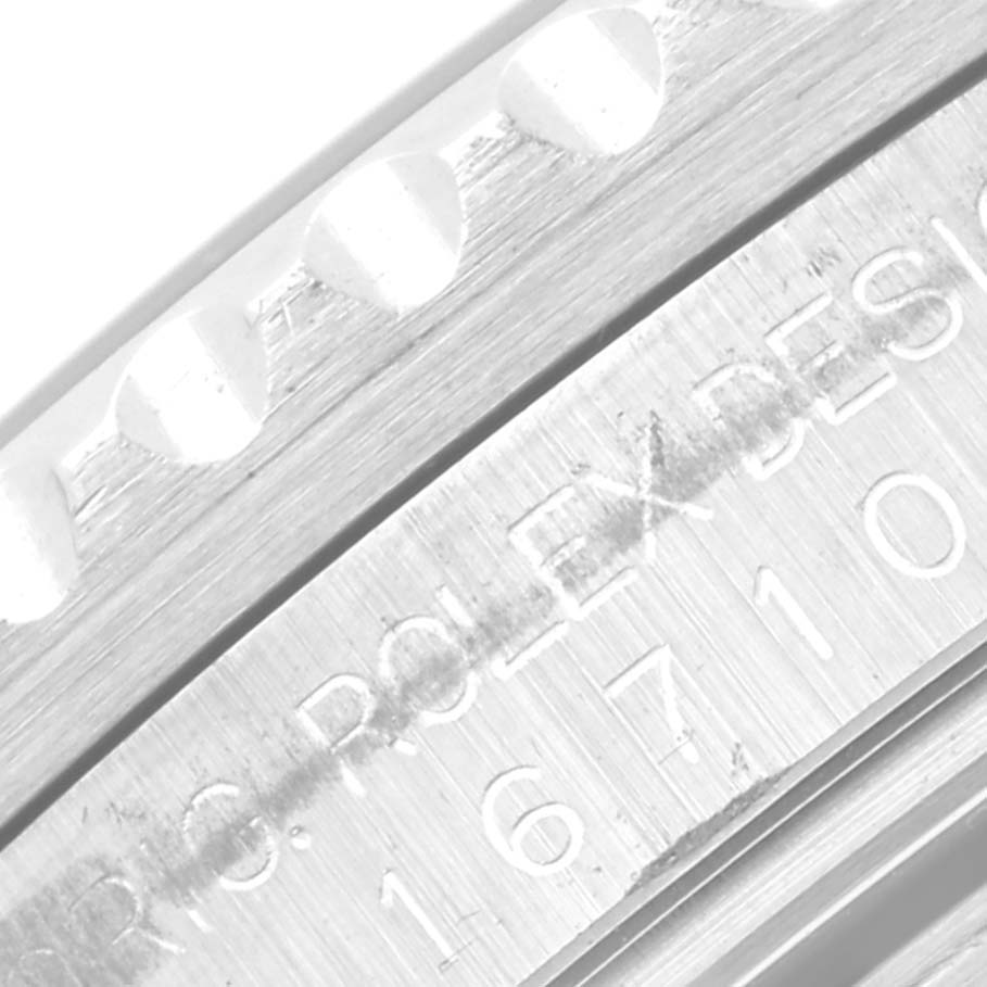 The image shows a close-up view of the bezel and engraved side of the Rolex GMT-Master 16710 Men
s Stainless Steel Black Dial 16710 Men
s Stainless Steel Black Dial watch, highlighting its model number.