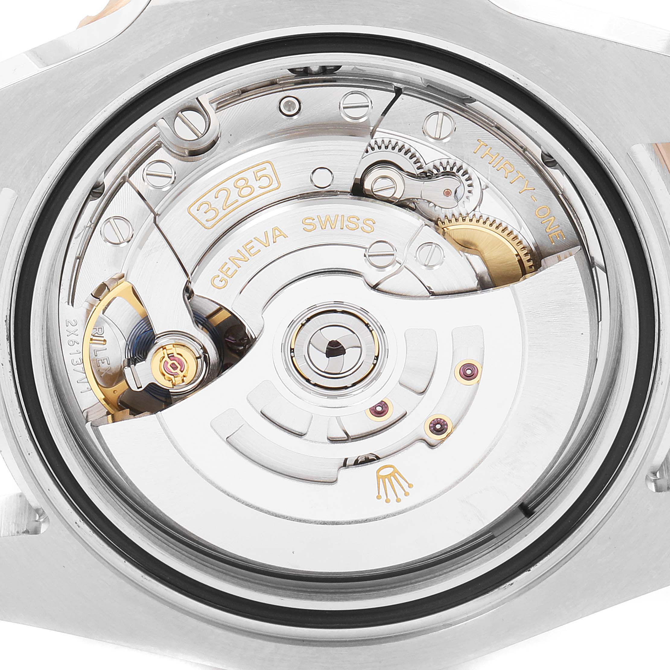 This is a close-up view of the movement mechanism inside a Rolex GMT-Master 126711 Men's Steel and Gold (two tone) Black Dial 126711 Men's Steel and Gold (two tone) Black Dial watch.