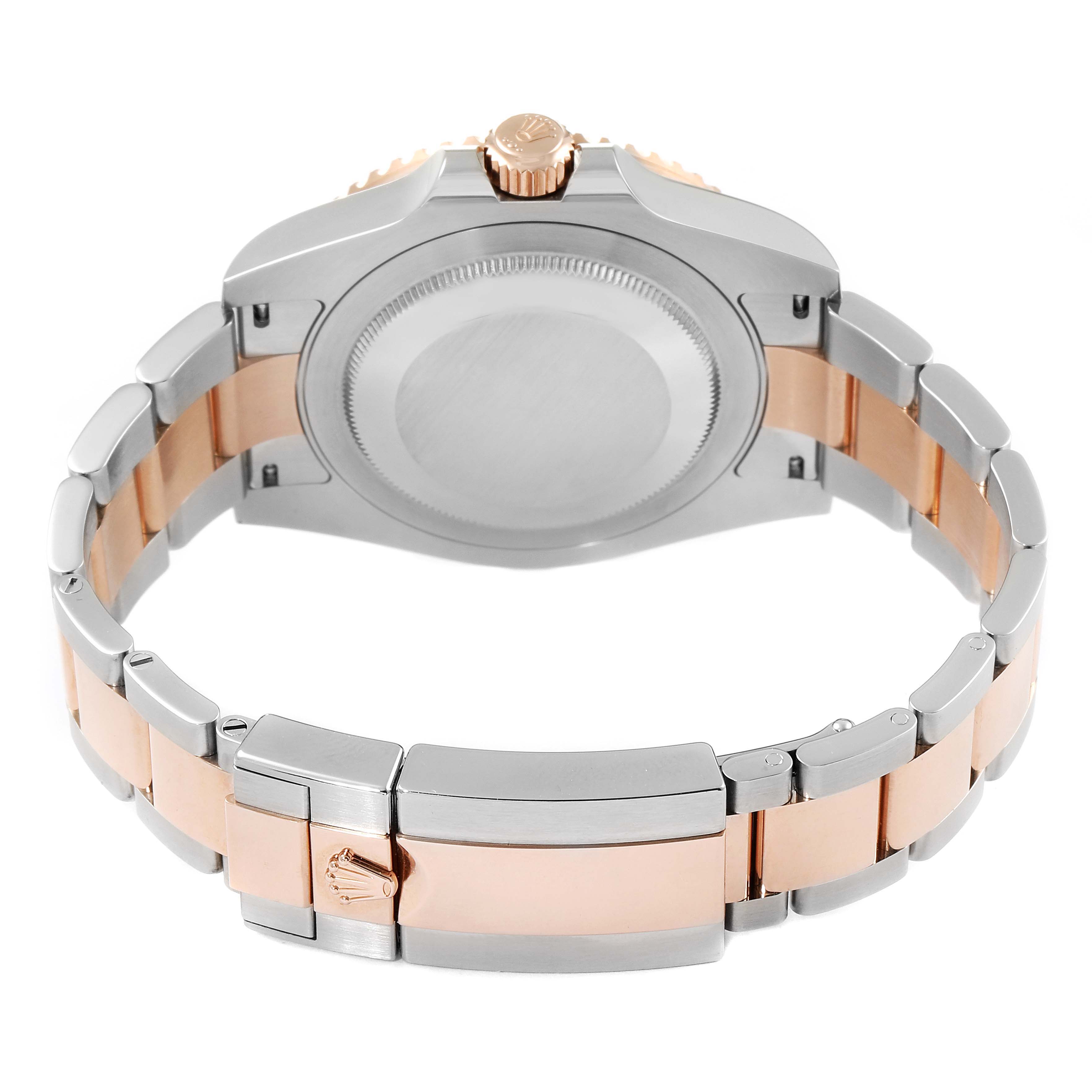 The image shows the back case and bracelet clasp of a Rolex GMT-Master 126711 Men's Steel and Gold (two tone) Black Dial 126711 Men's Steel and Gold (two tone) Black Dial watch, highlighting its bi-tone metal design.