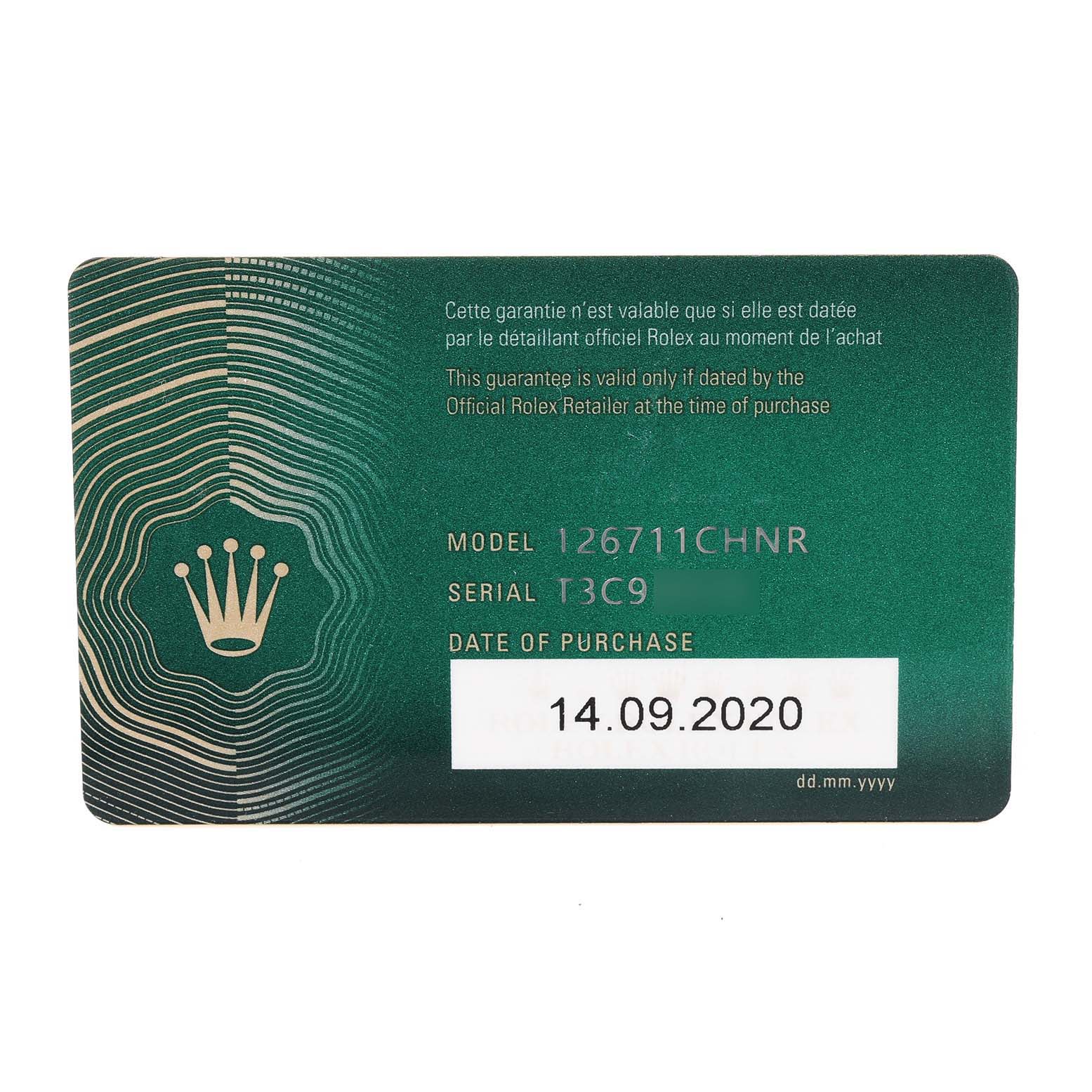 This image shows a warranty card with model number, serial number, and date of purchase for a Rolex GMT-Master 126711 Men's Steel and Gold (two tone) Black Dial 126711 Men's Steel and Gold (two tone) Black Dial.
