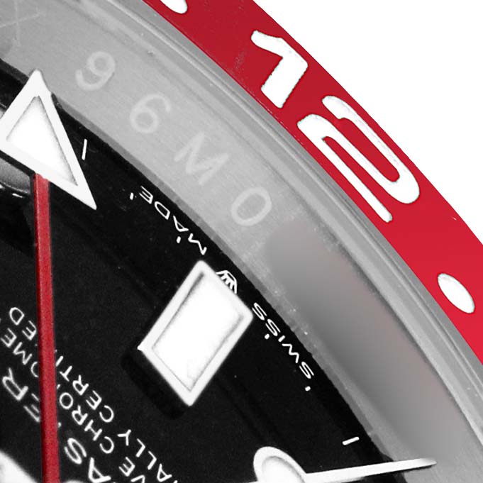 The image shows a close-up of the Rolex GMT-Master 126710 Men's Stainless Steel Black Dial's dial and red bezel with a 12-hour marker.