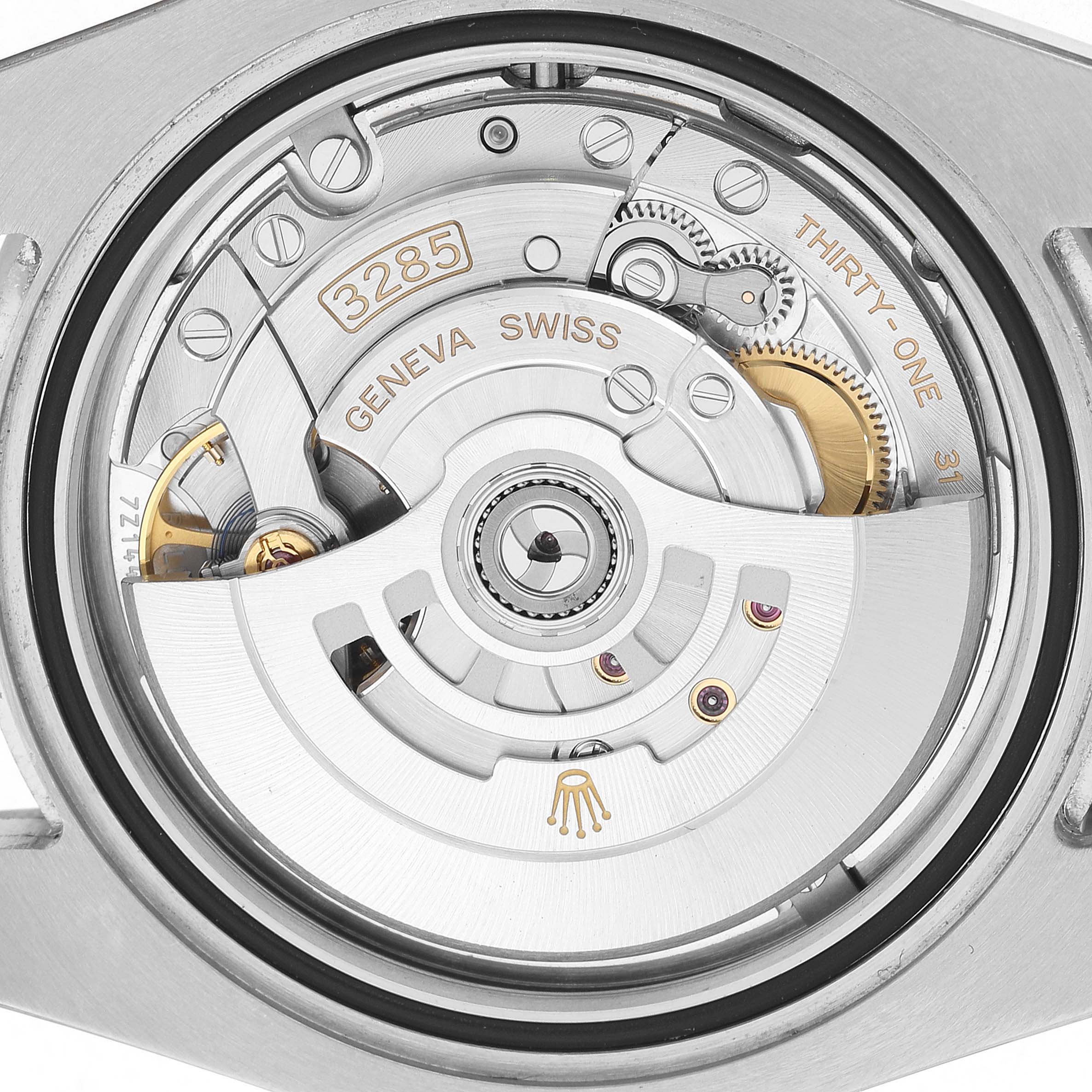 The image shows the movement of a Rolex GMT-Master 126710 Men's Stainless Steel Black Dial watch, featuring the 3285 caliber visible from the back.