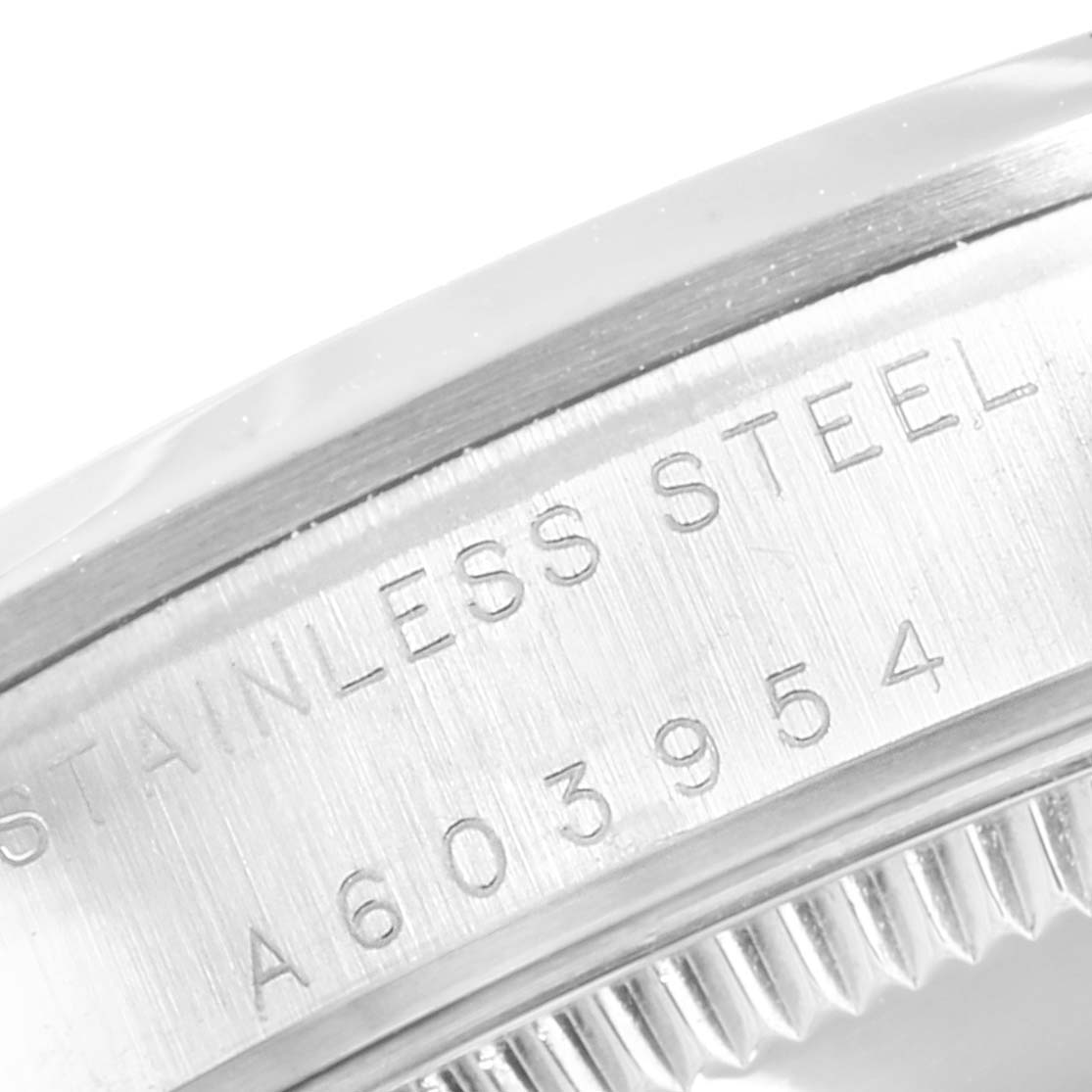 This image shows a close-up angle of the side of a Rolex Mid-Size 77080 Women
s Stainless Steel Pink Dial 77080 Women
s Stainless Steel Pink Dial model, displaying the stainless steel material and serial number.