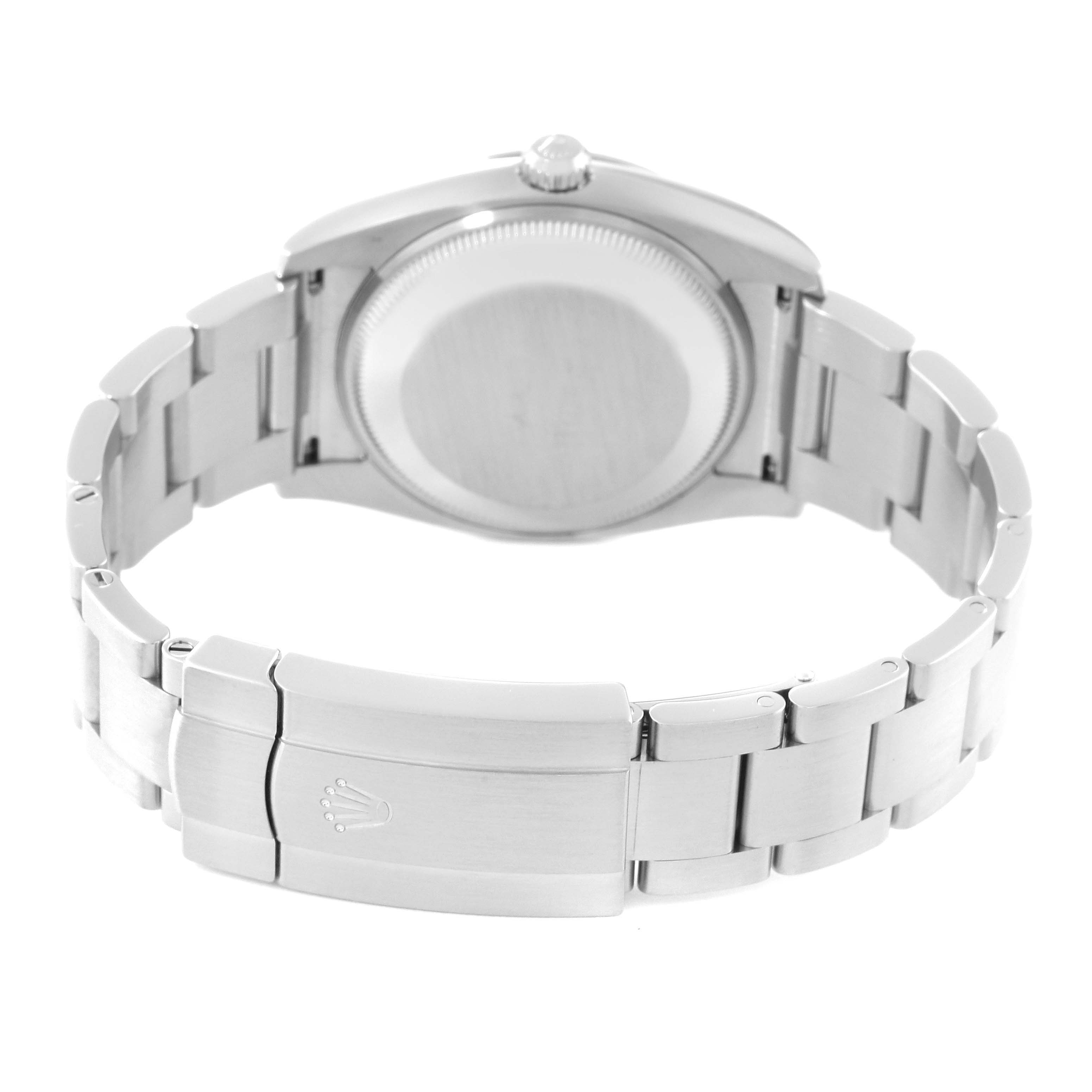 This image shows the back view of the Rolex Oyster Perpetual 114200 Men's Stainless Steel Champagne Dial 114200 Men's Stainless Steel Champagne Dial watch, highlighting the caseback and bracelet clasp.