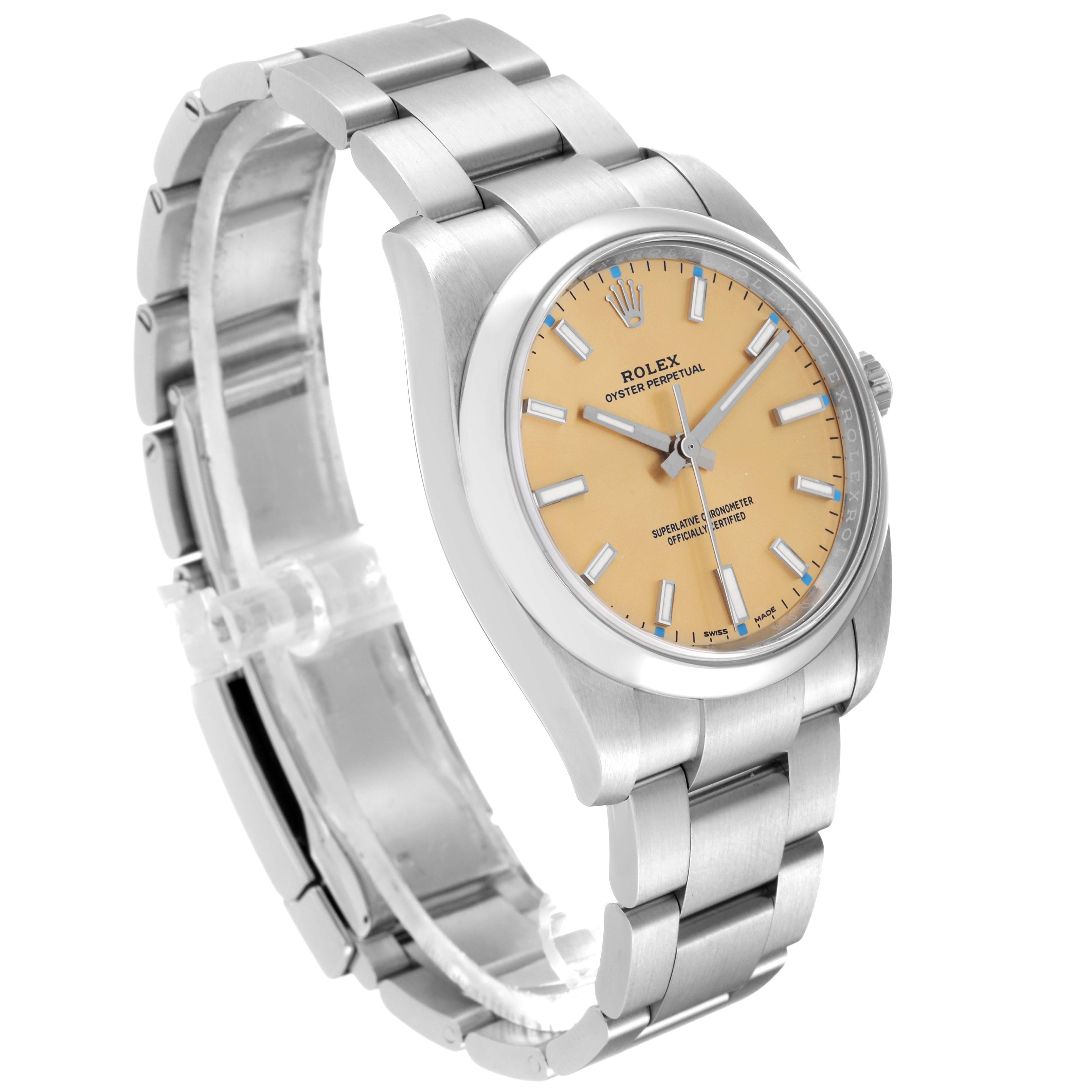 This Rolex Oyster Perpetual 114200 Men's Stainless Steel Champagne Dial 114200 Men's Stainless Steel Champagne Dial watch is shown from a three-quarter angle, highlighting its steel bracelet, beige dial, and bezel.