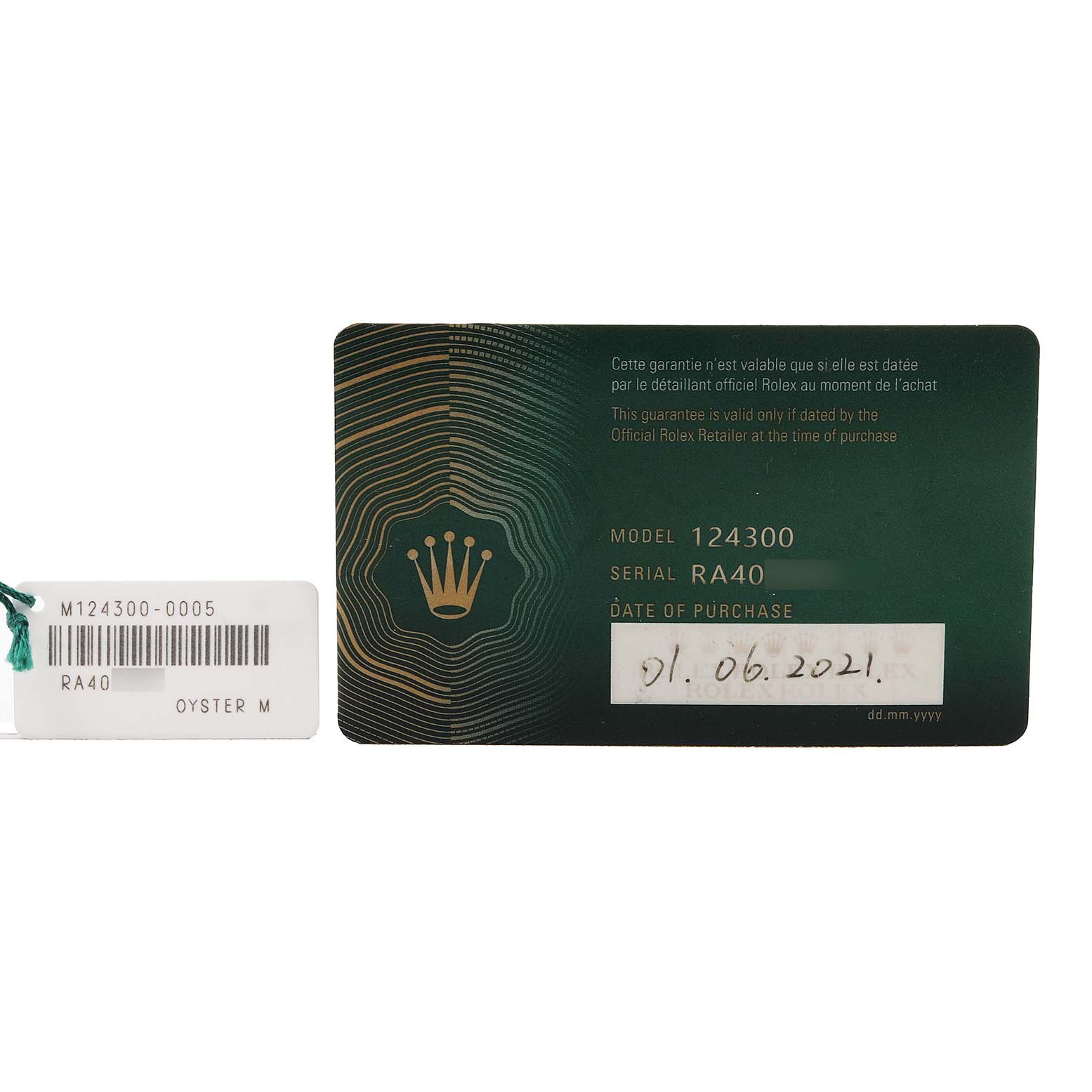 The image shows a Rolex Oyster Perpetual 124300-0005 Men's Stainless Steel Green Dial warranty card and a tag featuring model and serial numbers.