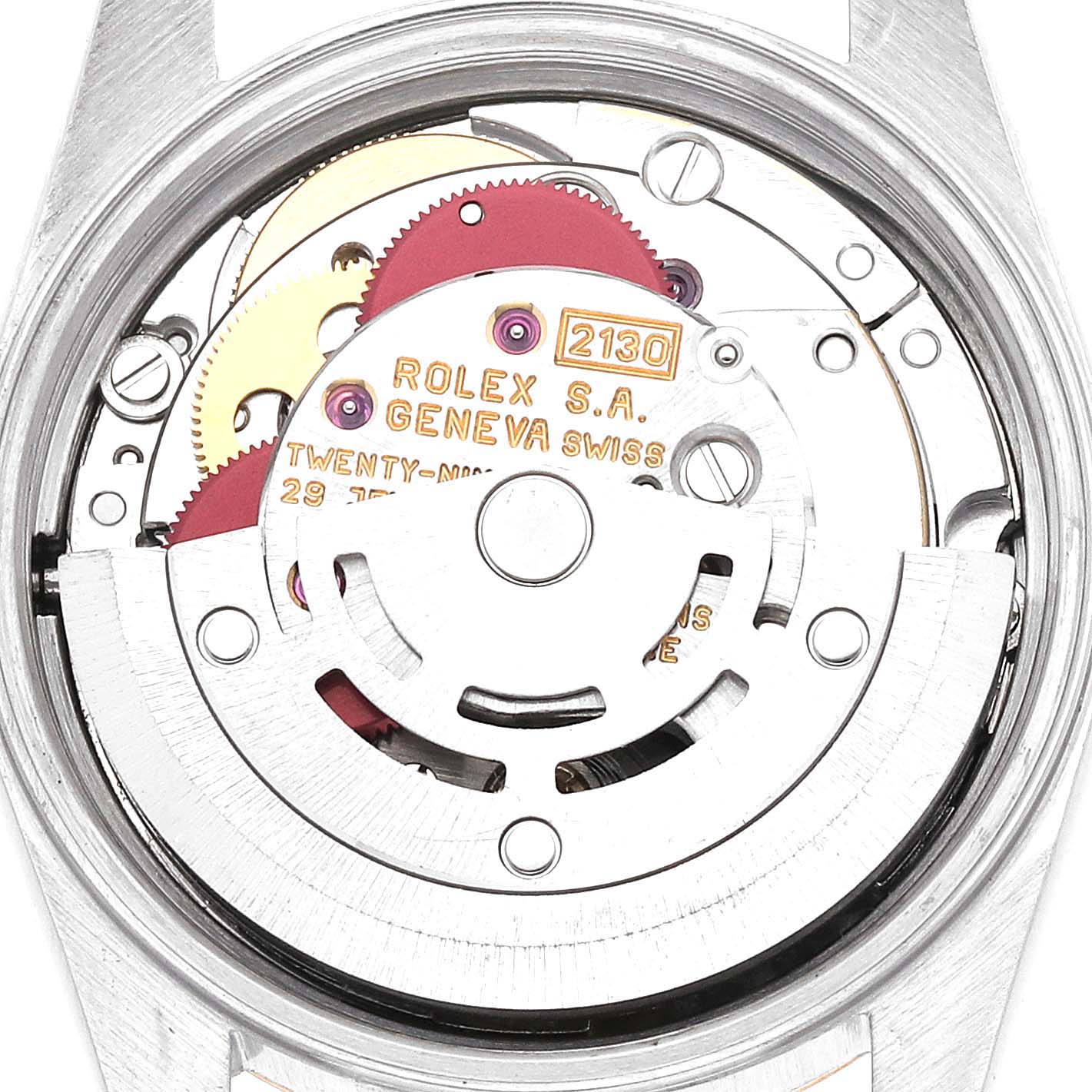 The image shows the interior movement of a Rolex Oyster Perpetual 67193 Women's Steel and Gold (two tone) Champagne Dial 67193 Women's Steel and Gold (two tone) Champagne Dial, highlighting gears and inscriptions from a rear angle.