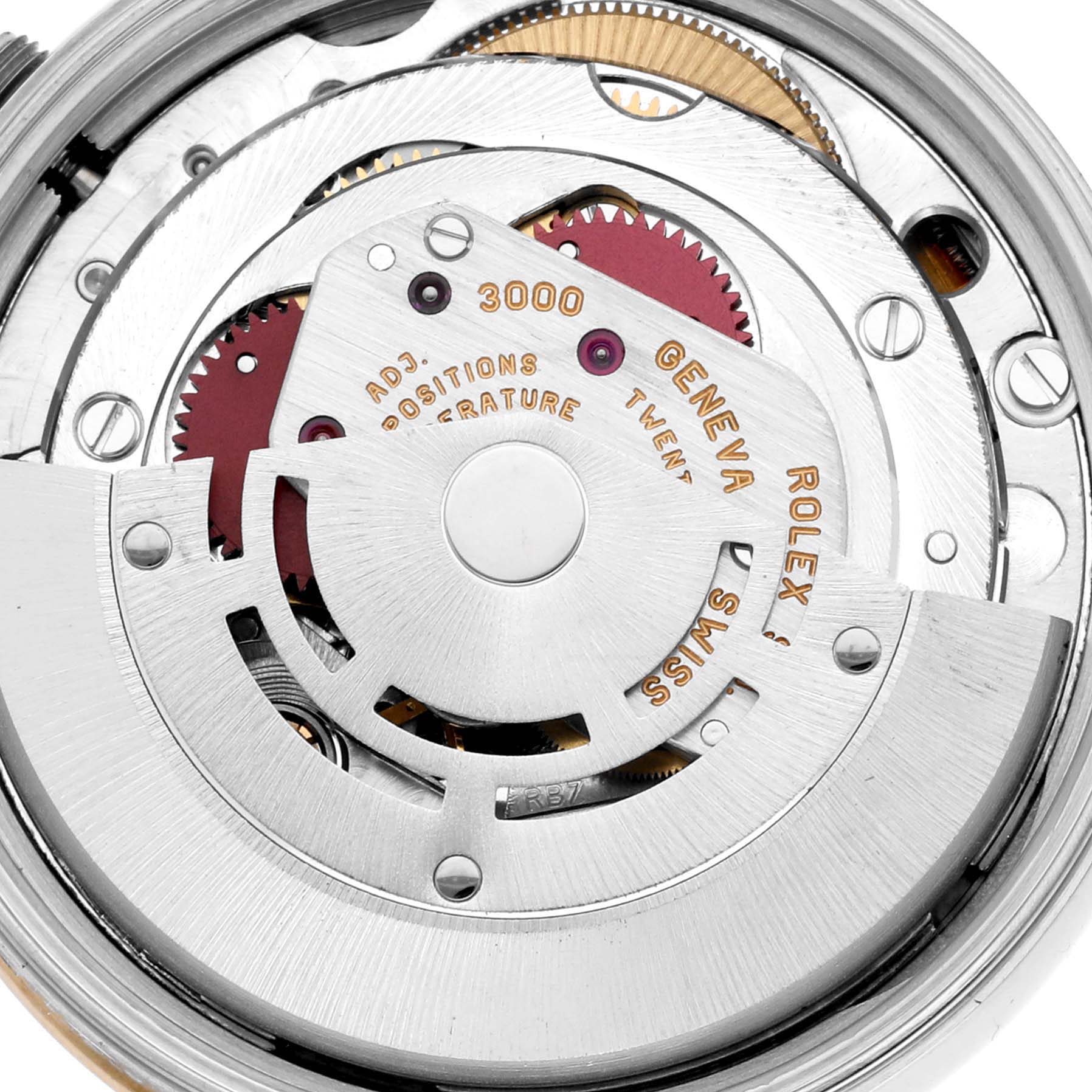 Close-up view of the movement components in a Rolex Oyster Perpetual 14203 Men's Steel and Gold (two tone) Grey Dial 14203 Men's Steel and Gold (two tone) Grey Dial, showcasing gears, rotor, and inscriptions.