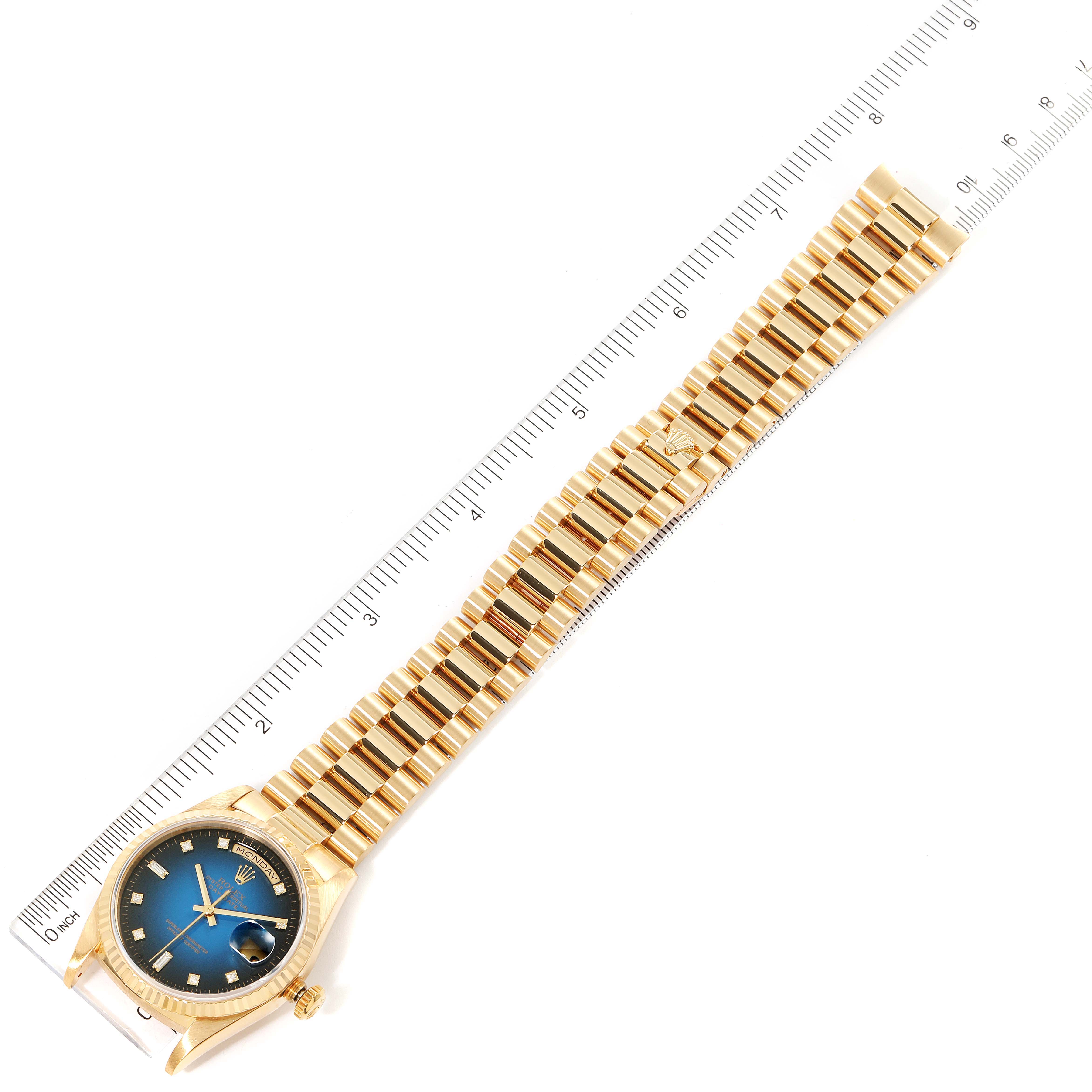 The image shows the full length of a Rolex President 18238 Men's Yellow Gold Blue Dial 18238 Men's Yellow Gold Blue Dial model watch, displayed next to a ruler for measurement.