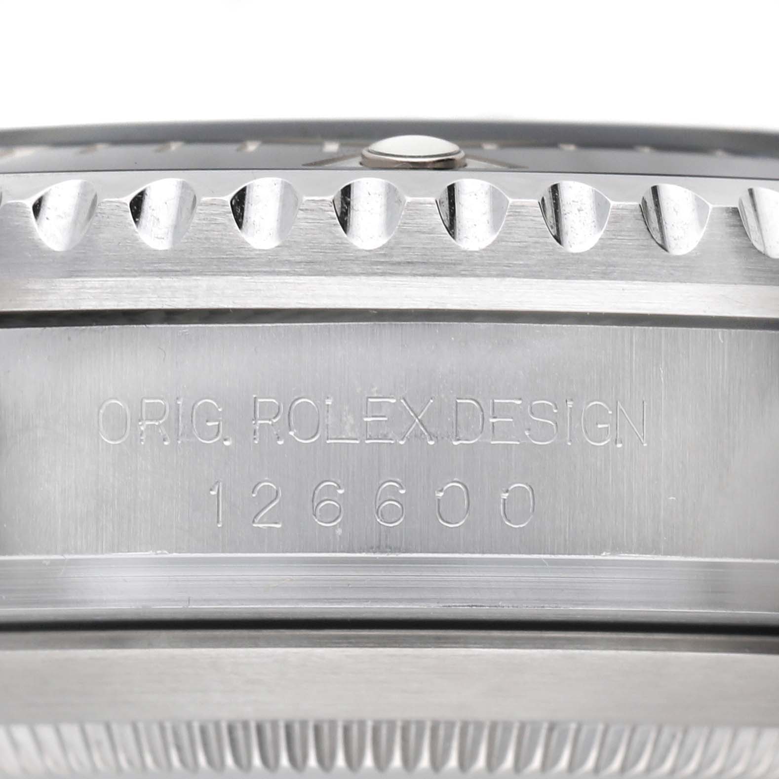 The image shows a close-up side view of the bezel and case side of a Rolex Sea-Dweller 126600 Men's Stainless Steel Black Dial, displaying the model number 126600.