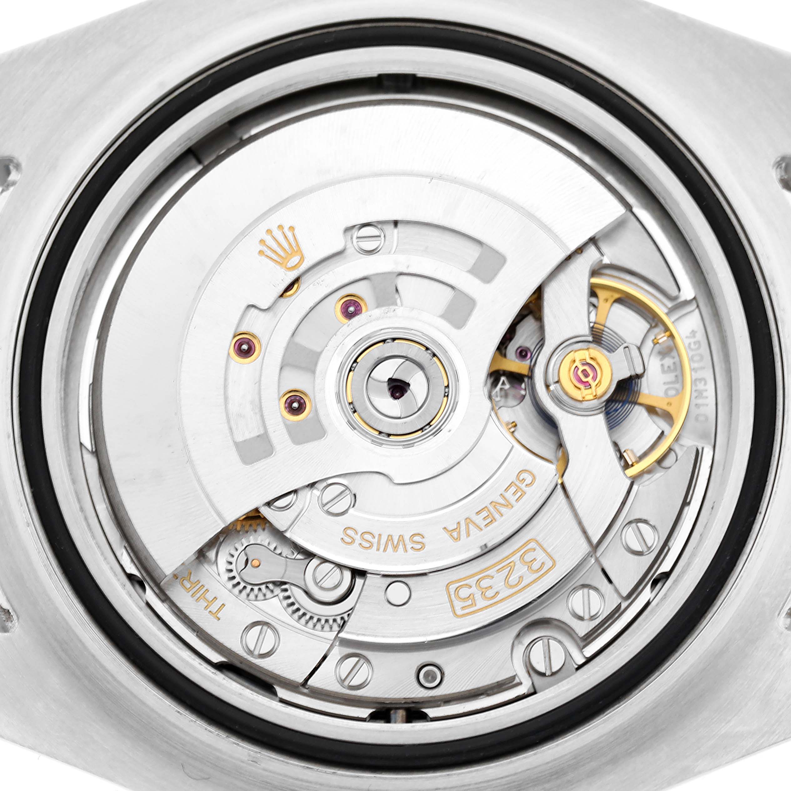 The image shows the movement of a Rolex Sea-Dweller 126600 Men's Stainless Steel Black Dial, highlighting its intricate internal mechanics from a top-down angle.