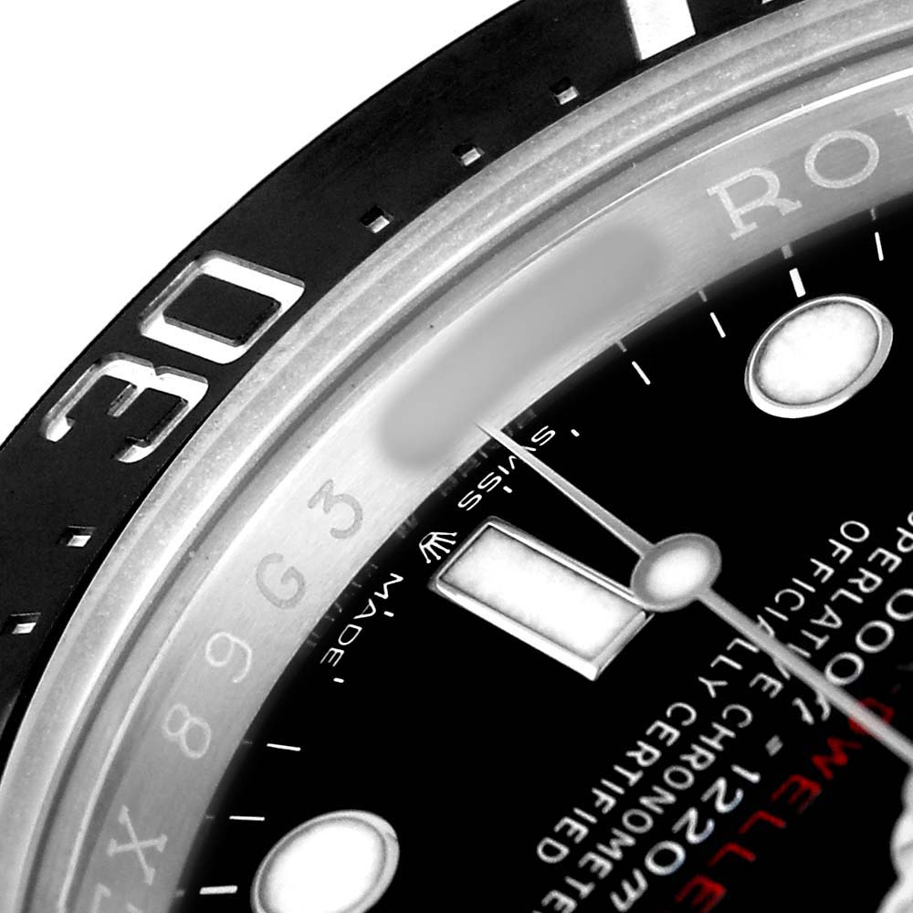 The image shows a close-up of the dial and bezel of a Rolex Sea-Dweller 126600 Men's Stainless Steel Black Dial watch, highlighting the markers and text.