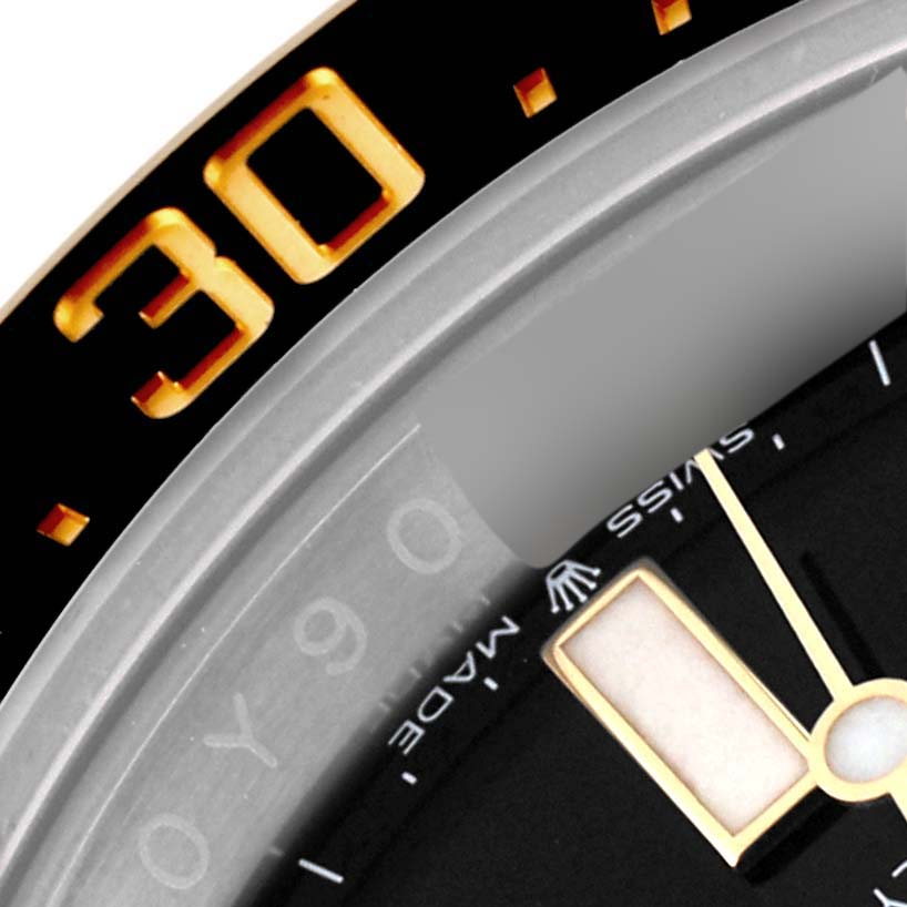 The close-up angle shows part of the bezel, dial, and hands of the Rolex Sea-Dweller 126603 Men
s Steel and Gold (two tone) Black Dial 126603 Men
s Steel and Gold (two tone) Black Dial.