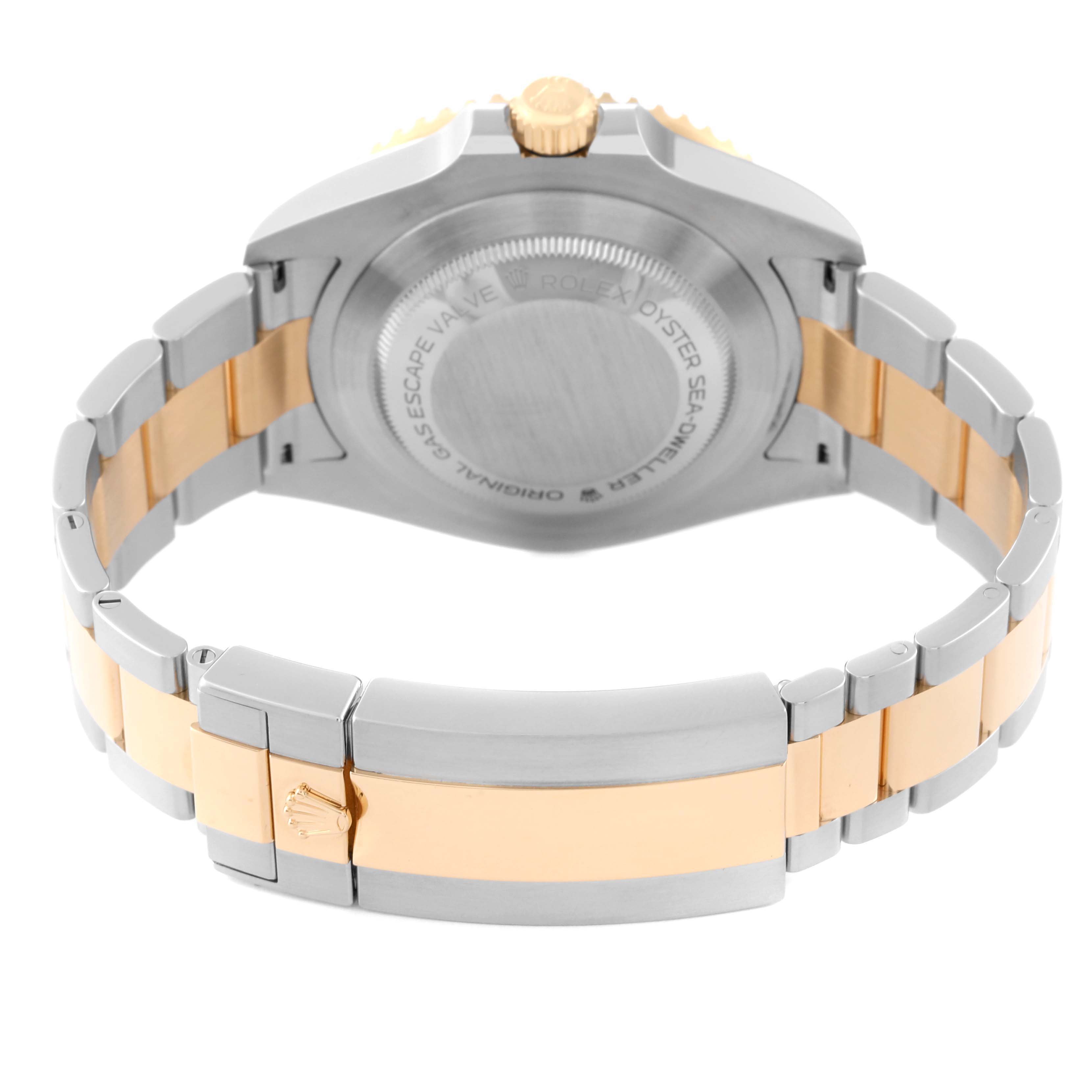 The angle shows the back of the Rolex Sea-Dweller 126603 Men
s Steel and Gold (two tone) Black Dial 126603 Men
s Steel and Gold (two tone) Black Dial watch, highlighting the case back and bracelet clasp.