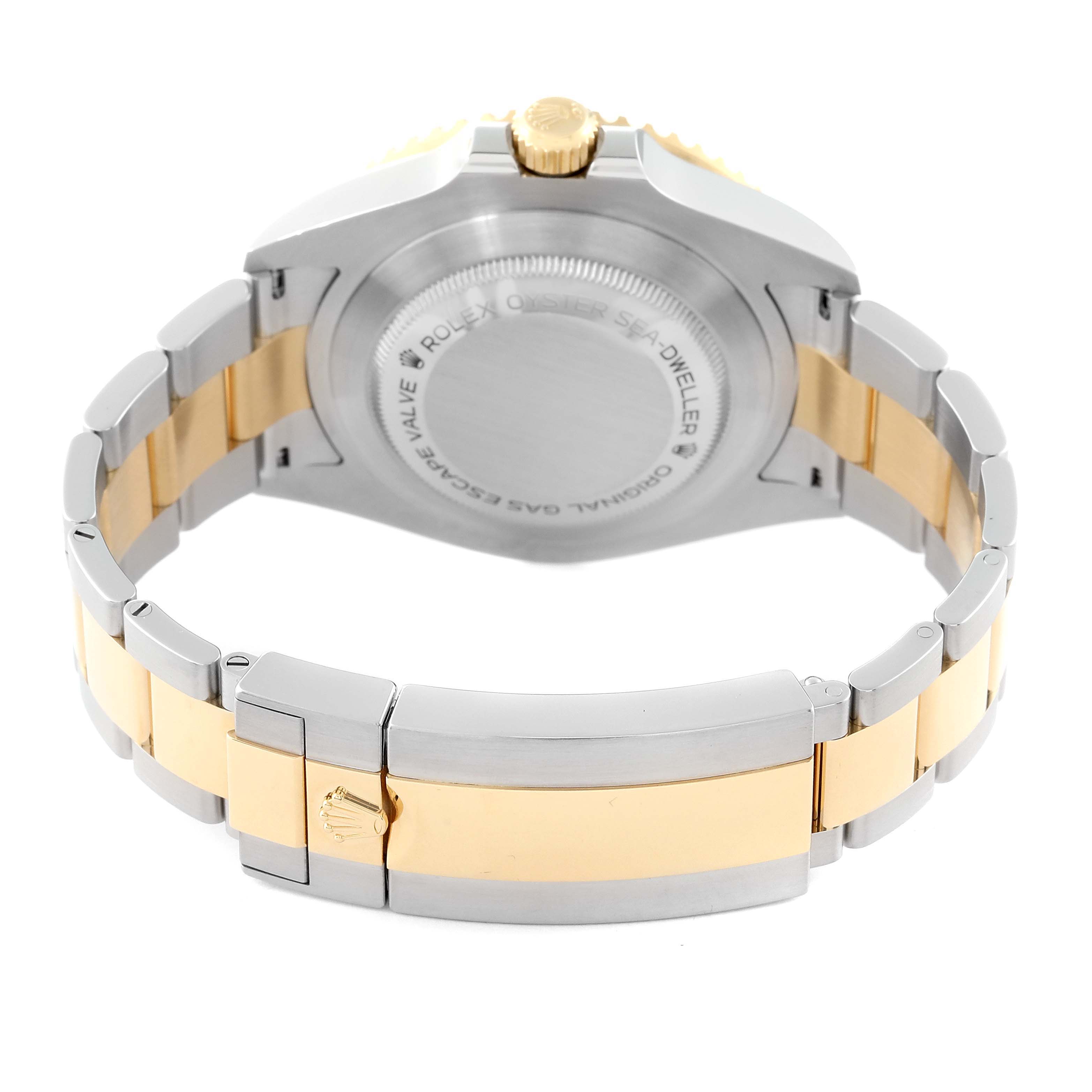 This image shows the back case and bracelet clasp of a Rolex Sea-Dweller 126603 Men's Steel and Gold (two tone) Black Dial 126603 Men's Steel and Gold (two tone) Black Dial watch, emphasizing the gold and silver two-tone design.