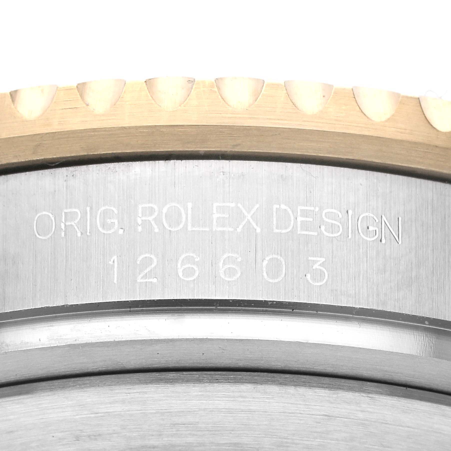 This image shows a close-up of the case side engraving and bezel of the Rolex Sea-Dweller 126603 Men's Steel and Gold (two tone) Black Dial 126603 Men's Steel and Gold (two tone) Black Dial 126603.
