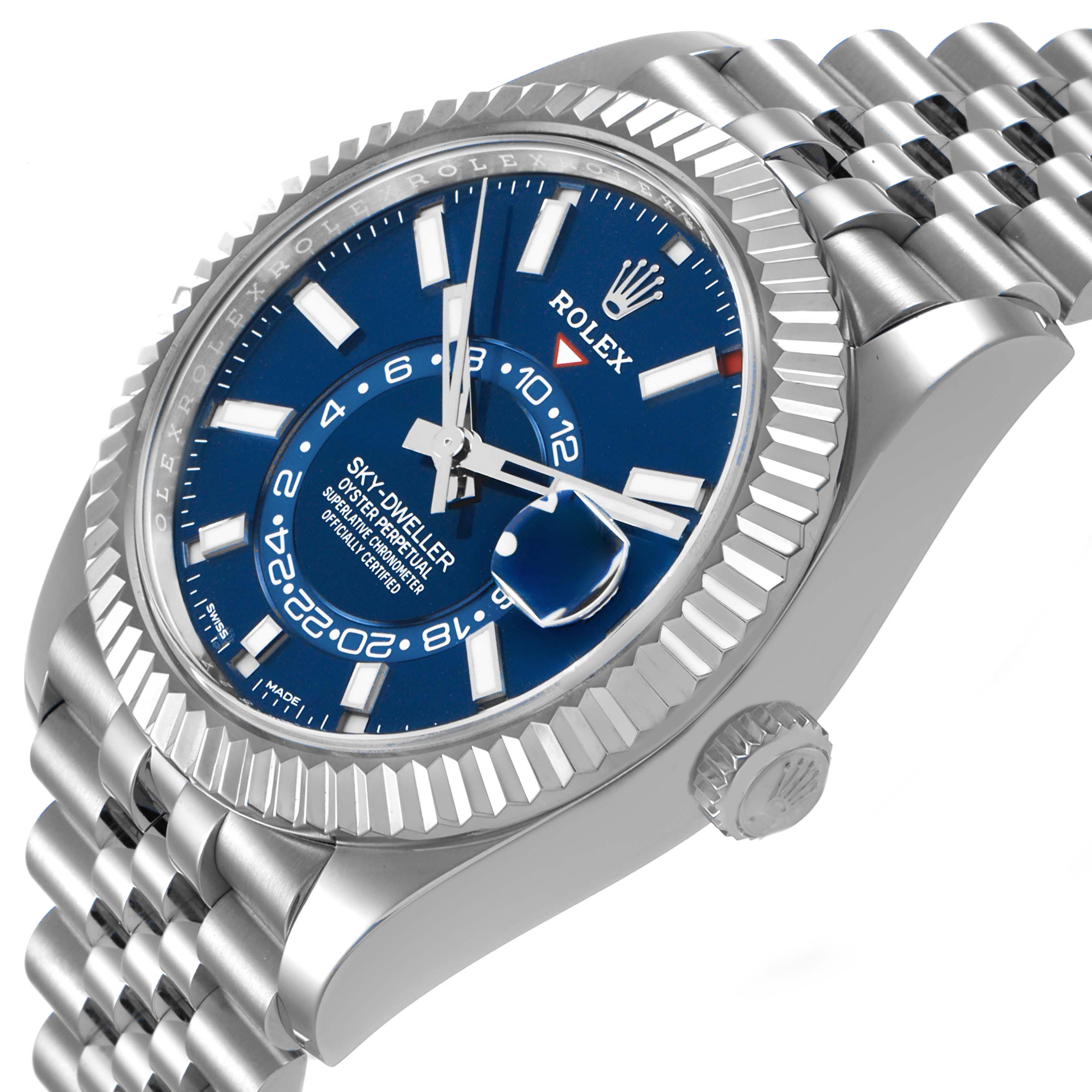 The Rolex Sky-Dweller 336934 Men's Stainless Steel Blue Dial is shown at an angle highlighting the blue dial, fluted bezel, and Jubilee bracelet.
