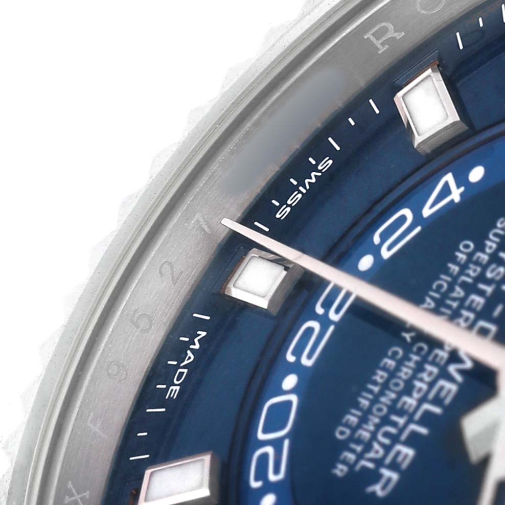 The image shows a close-up of the dial and bezel of a Rolex Sky-Dweller 336934 Men's Stainless Steel Blue Dial, highlighting the watch face, indices, and hand.