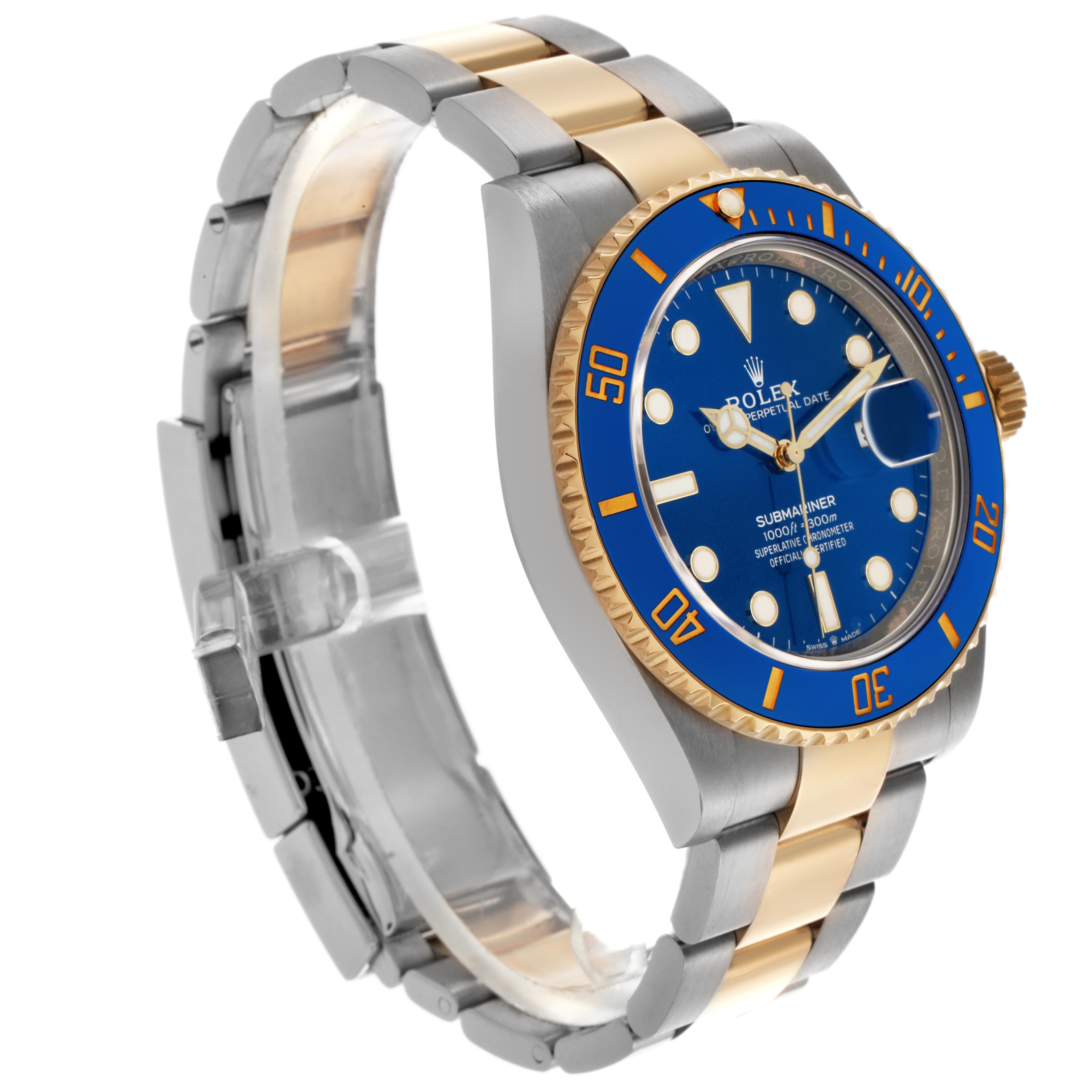 The Rolex Submariner 126613 Men
s Steel and Gold (two tone) Blue Dial 126613 Men
s Steel and Gold (two tone) Blue Dial is shown at a three-quarter angle, featuring the bezel, dial, crown, and part of the metal bracelet.