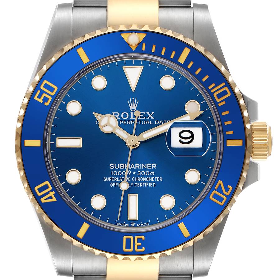 The image shows a front view of a Rolex Submariner watch, highlighting its blue dial, gold accents, and date window.
