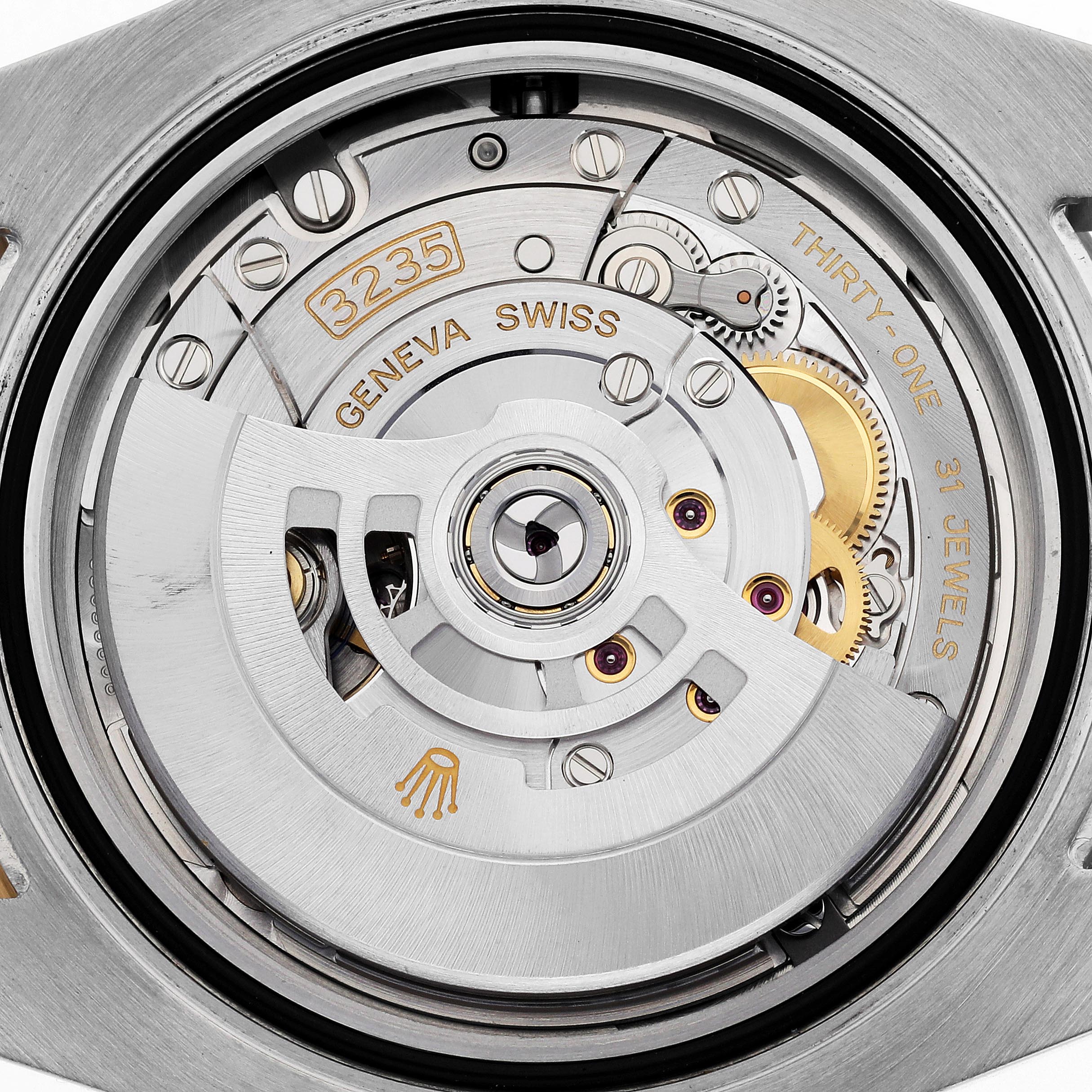 The image shows the intricate movement of a Rolex Submariner 126613 Men
s Steel and Gold (two tone) Blue Dial 126613 Men
s Steel and Gold (two tone) Blue Dial, highlighting gears and jewels from the back.