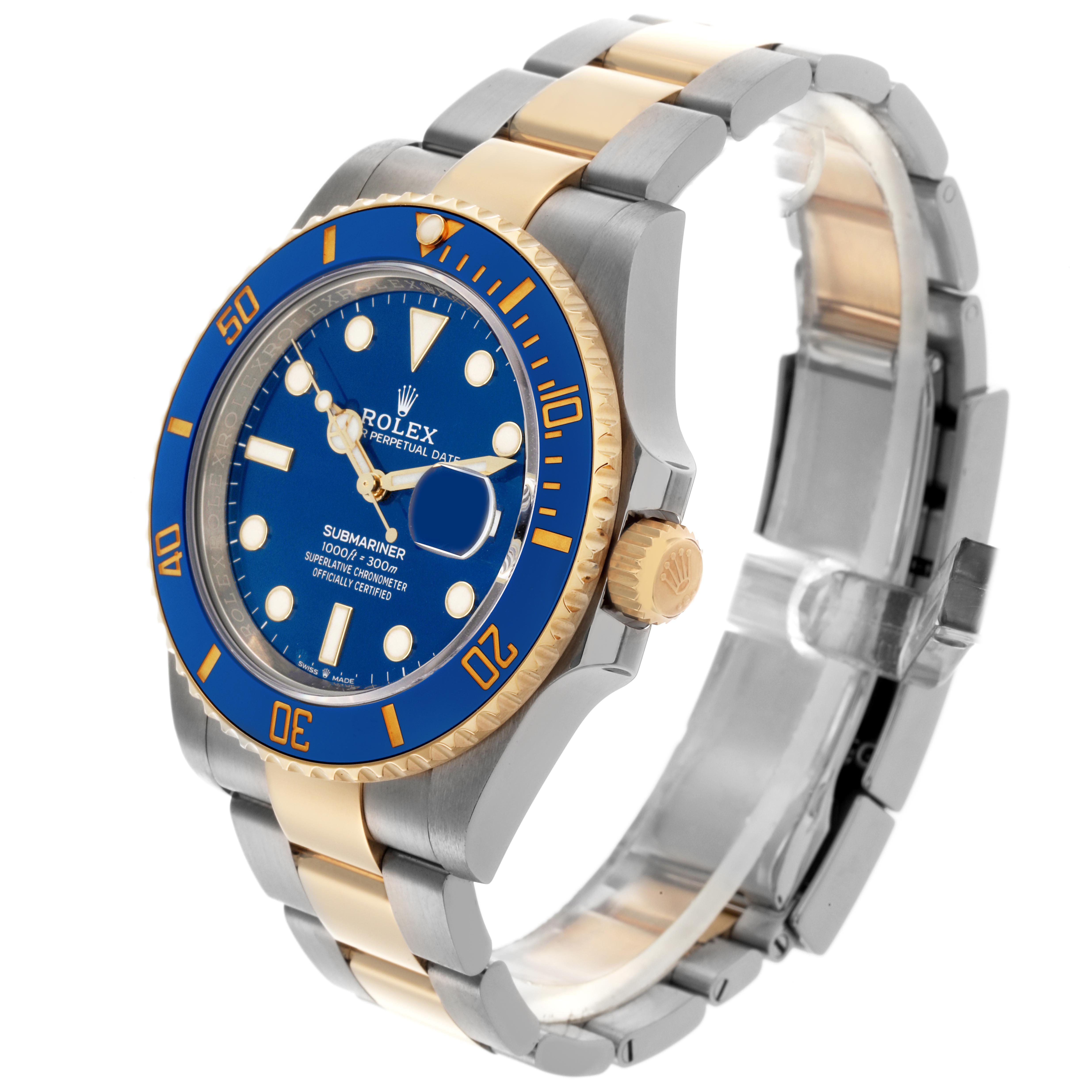 The image shows a Rolex Submariner 126613 Men
s Steel and Gold (two tone) Blue Dial 126613 Men
s Steel and Gold (two tone) Blue Dial at a 3/4 angle highlighting the blue dial, bezel, and two-tone bracelet.