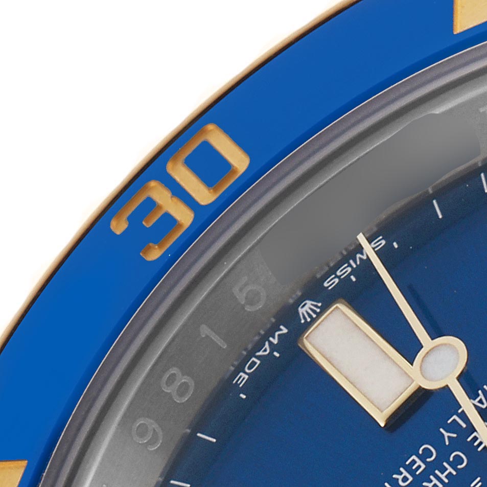 The image shows a close-up of the blue and gold bezel and dial of a Rolex Submariner 126613 Men
s Steel and Gold (two tone) Blue Dial 126613 Men
s Steel and Gold (two tone) Blue Dial.