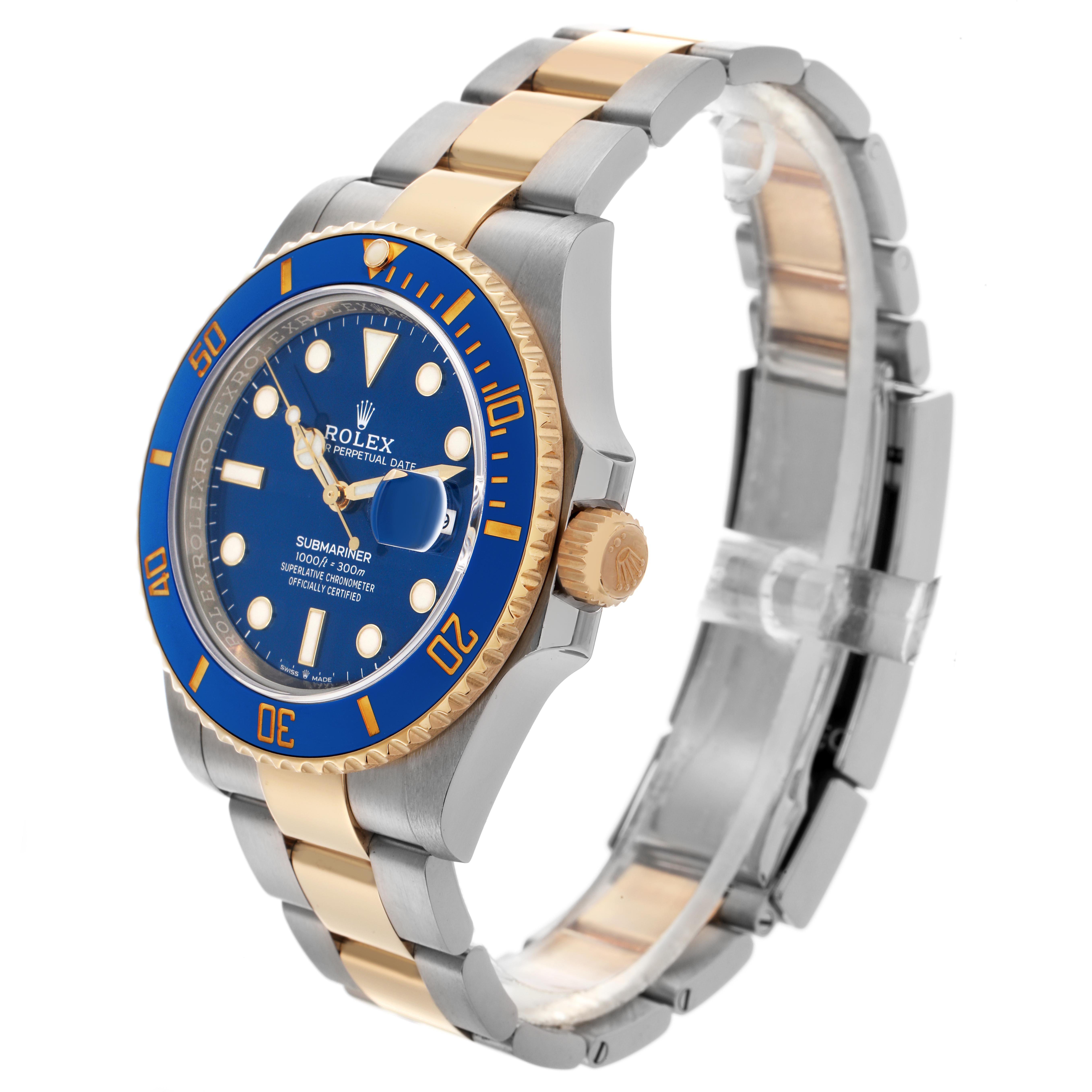 The Rolex Submariner 126613 Men
s Steel and Gold (two tone) Blue Dial 126613 Men
s Steel and Gold (two tone) Blue Dial watch is shown at a three-quarter angle, displaying its blue dial, bezel, and two-tone bracelet.