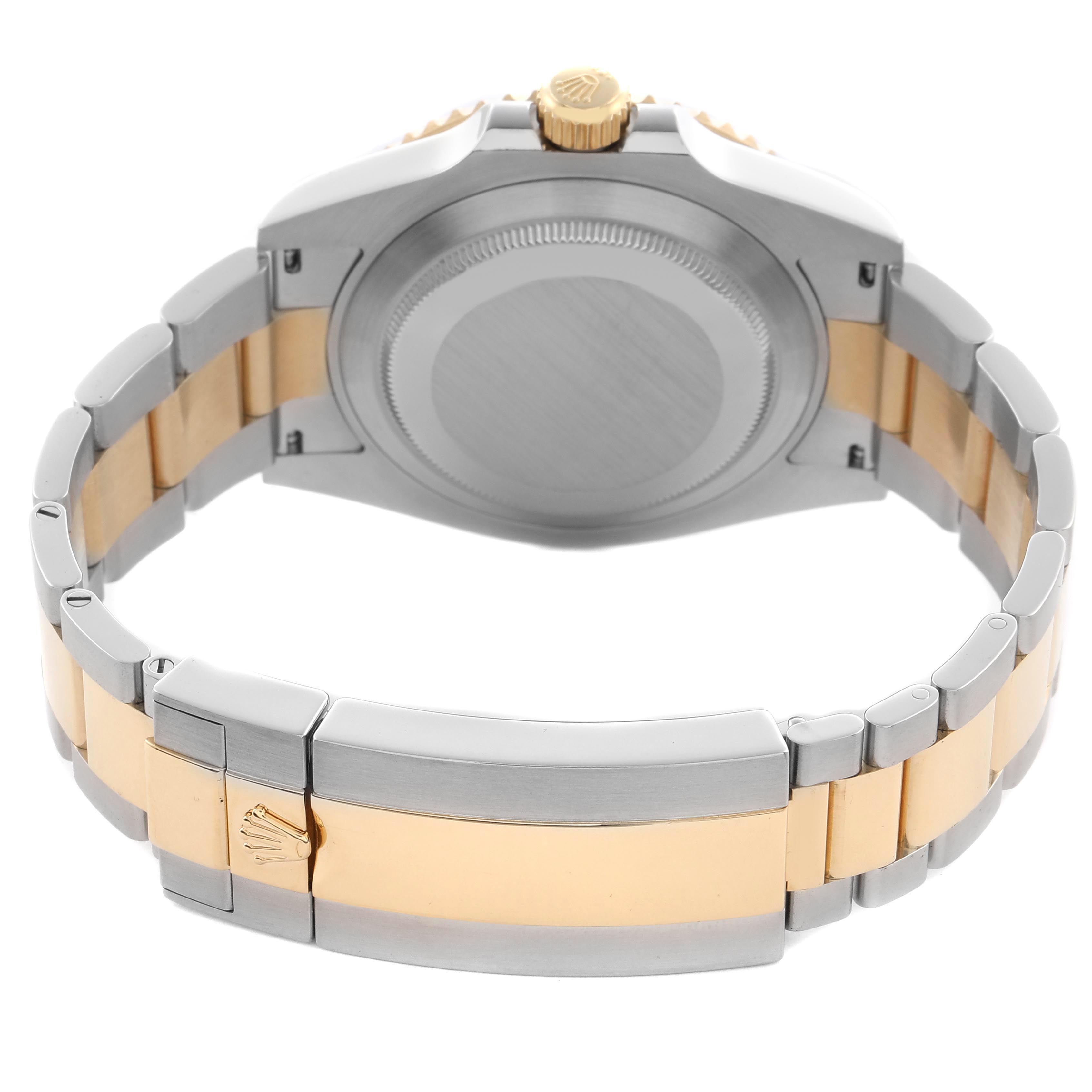 The image shows the back of a Rolex Submariner 126613 Men
s Steel and Gold (two tone) Blue Dial 126613 Men
s Steel and Gold (two tone) Blue Dial watch, highlighting its clasp, bracelet, and case back.