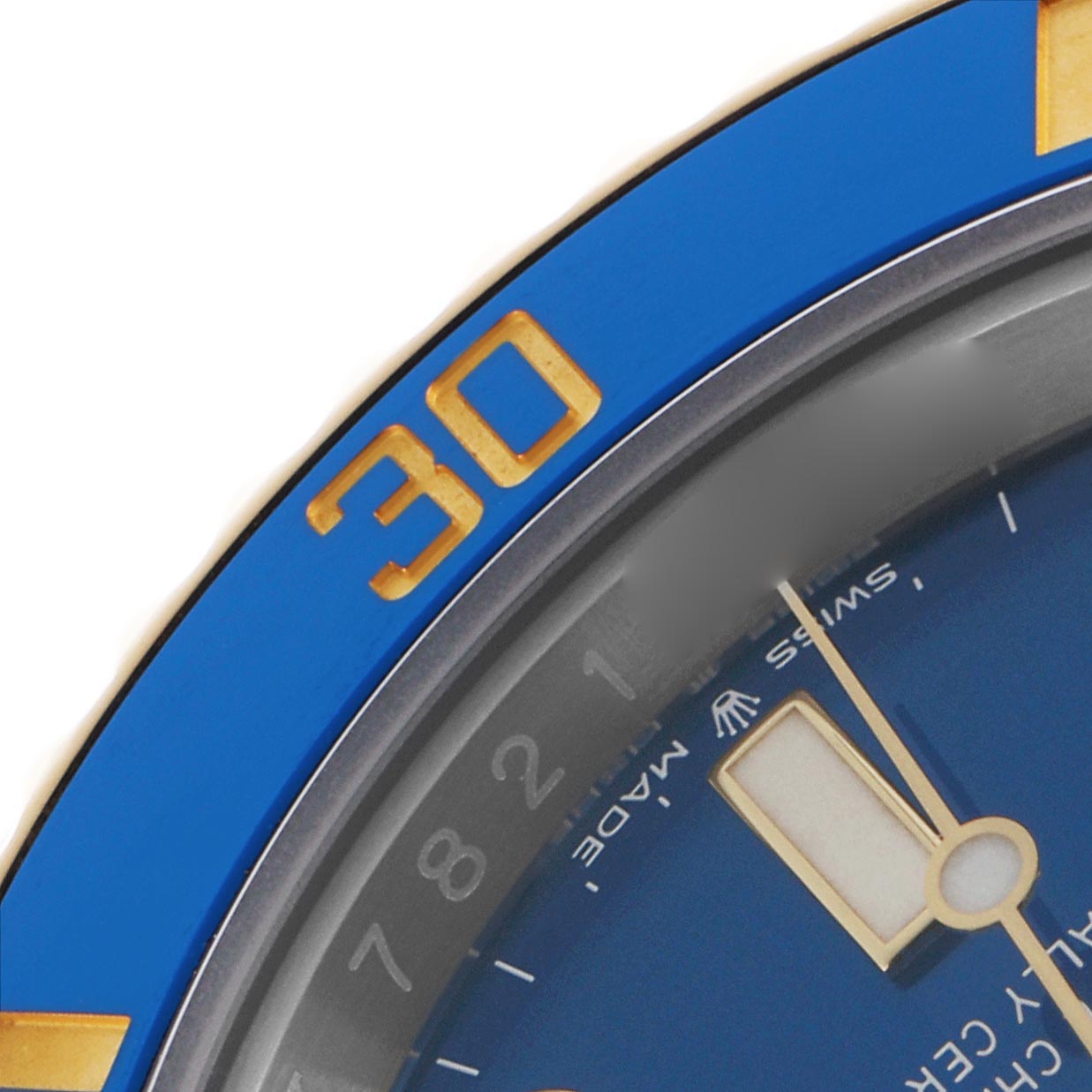 The image shows a close-up of the Rolex Submariner 126613 Men
s Steel and Gold (two tone) Blue Dial 126613 Men
s Steel and Gold (two tone) Blue Dial
s blue bezel and watch face, highlighting the 
30
 marker and part of the minute hand.