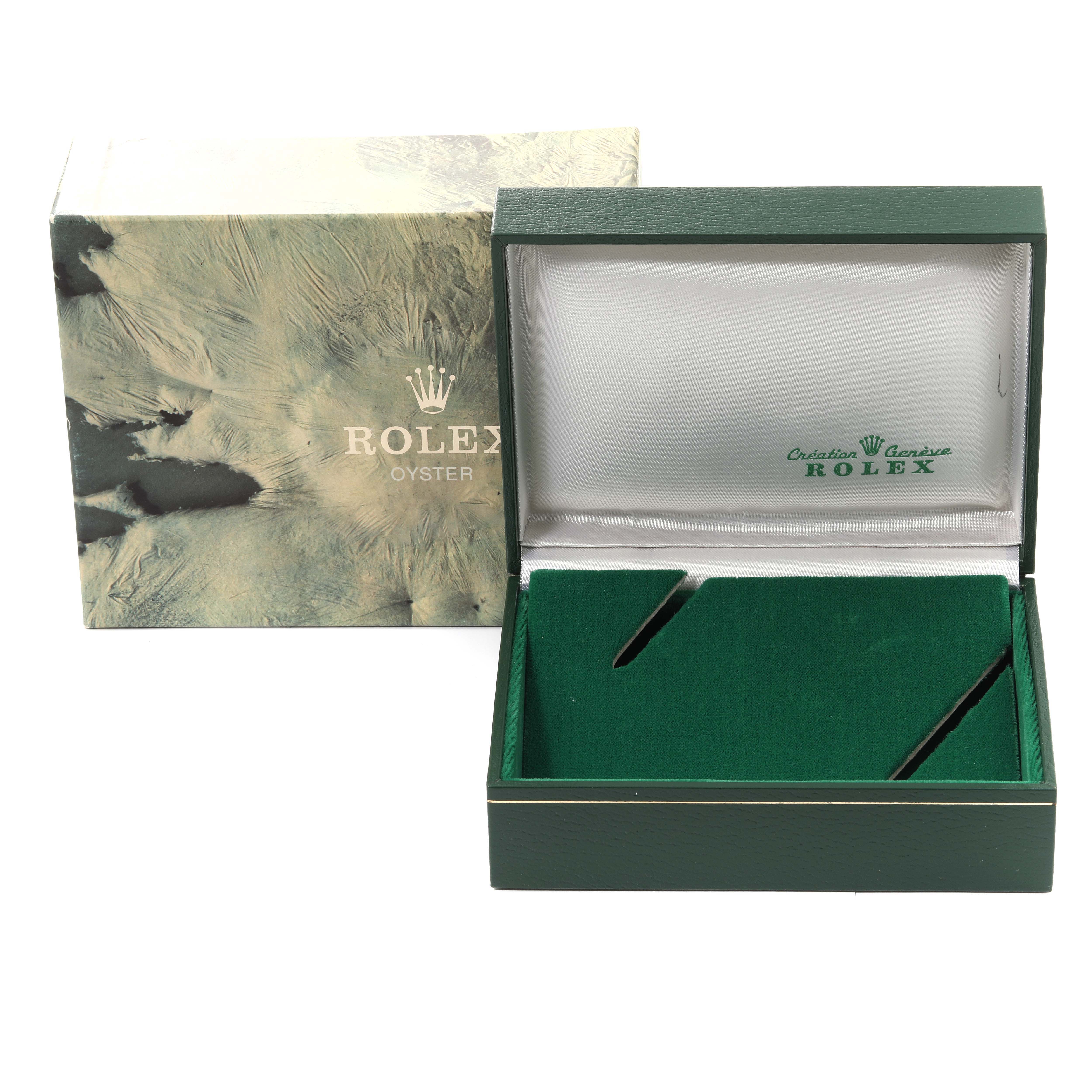 The image shows an open Rolex Submariner 168000 Men
s Stainless Steel Black Dial 168000 Men
s Stainless Steel Black Dial watch box, viewed from the front, along with its outer packaging.