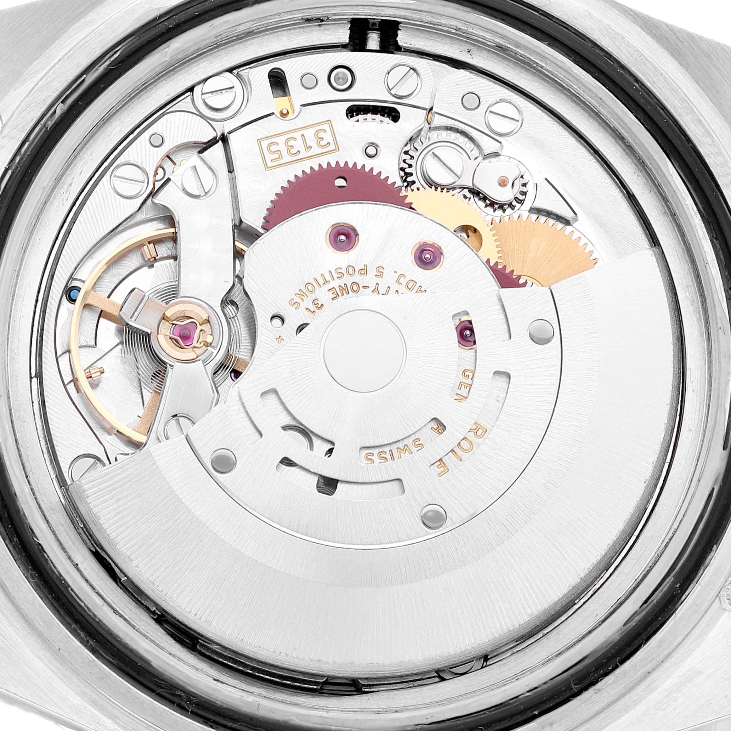 The image shows the movement mechanism of a Rolex Submariner 16610 Men
s Stainless Steel Black Dial 16610 Men
s Stainless Steel Black Dial watch from the back, highlighting gears and rotor details.