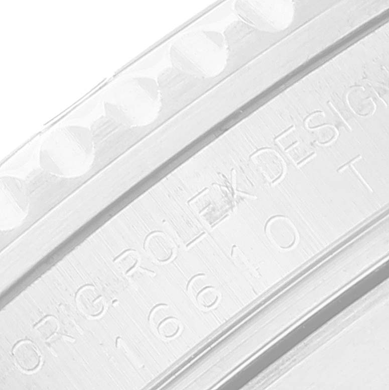 The image shows a close-up of the engraved bezel and case edge of a Rolex Submariner 16610 Men
s Stainless Steel Black Dial 16610 Men
s Stainless Steel Black Dial.