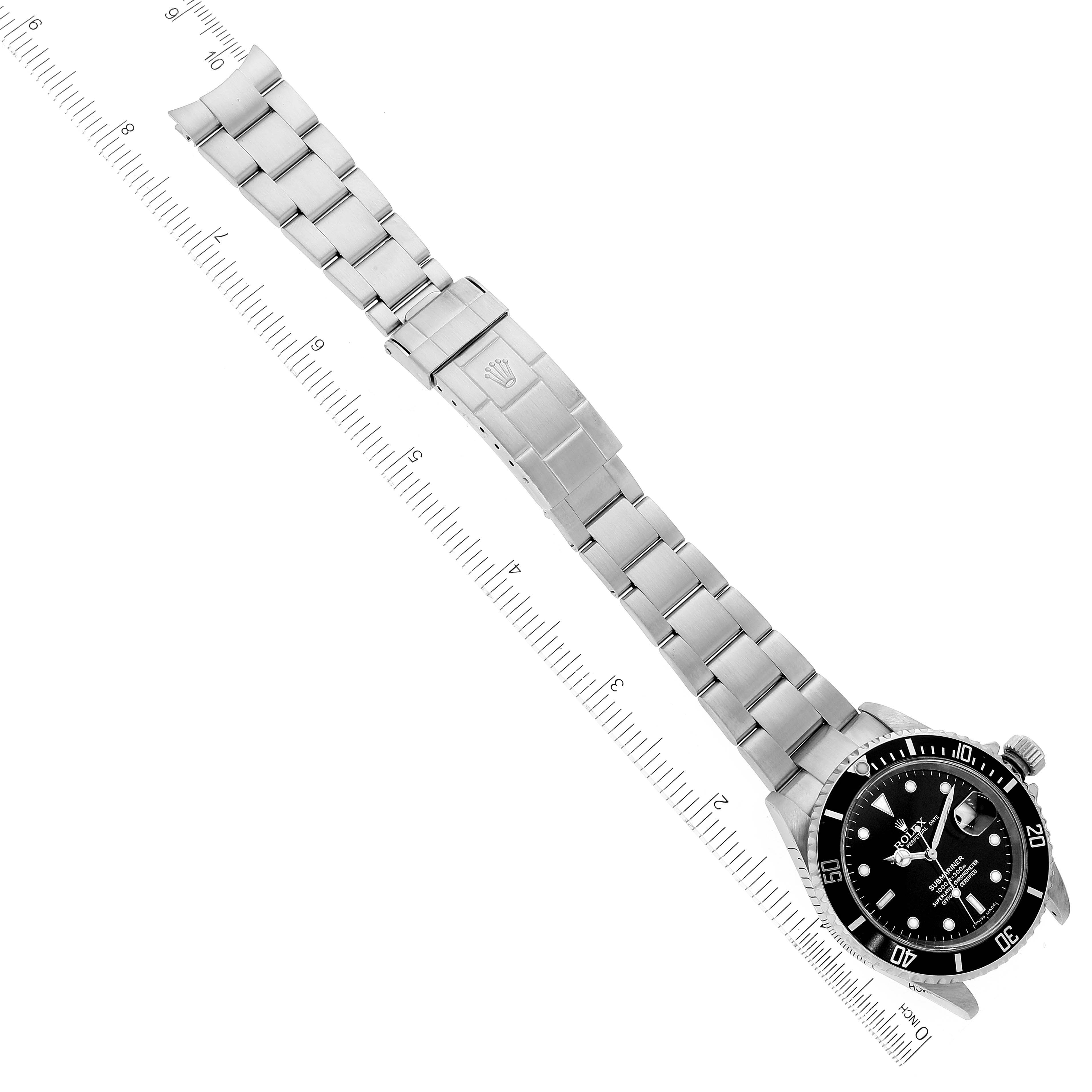 The Rolex Submariner 16610 Men
s Stainless Steel Black Dial 16610 Men
s Stainless Steel Black Dial watch is shown from a top-down angle, displaying the case, dial, bezel, bracelet, and clasp.