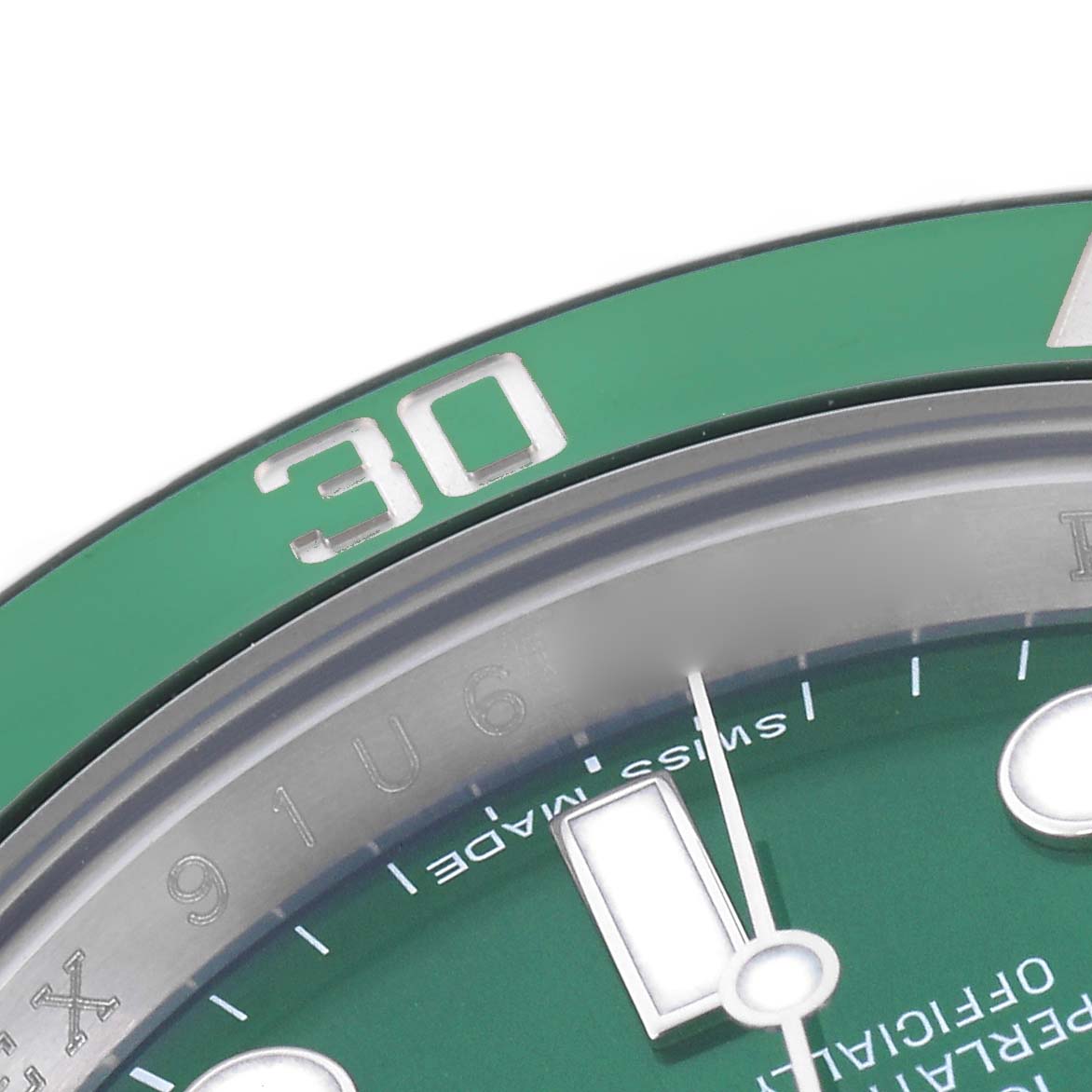 The image shows a close-up of the bezel and dial of a Rolex Submariner 116610LV Men
s Stainless Steel Green Dial 116610LV Men
s Stainless Steel Green Dial, focusing on the 30-minute marker.