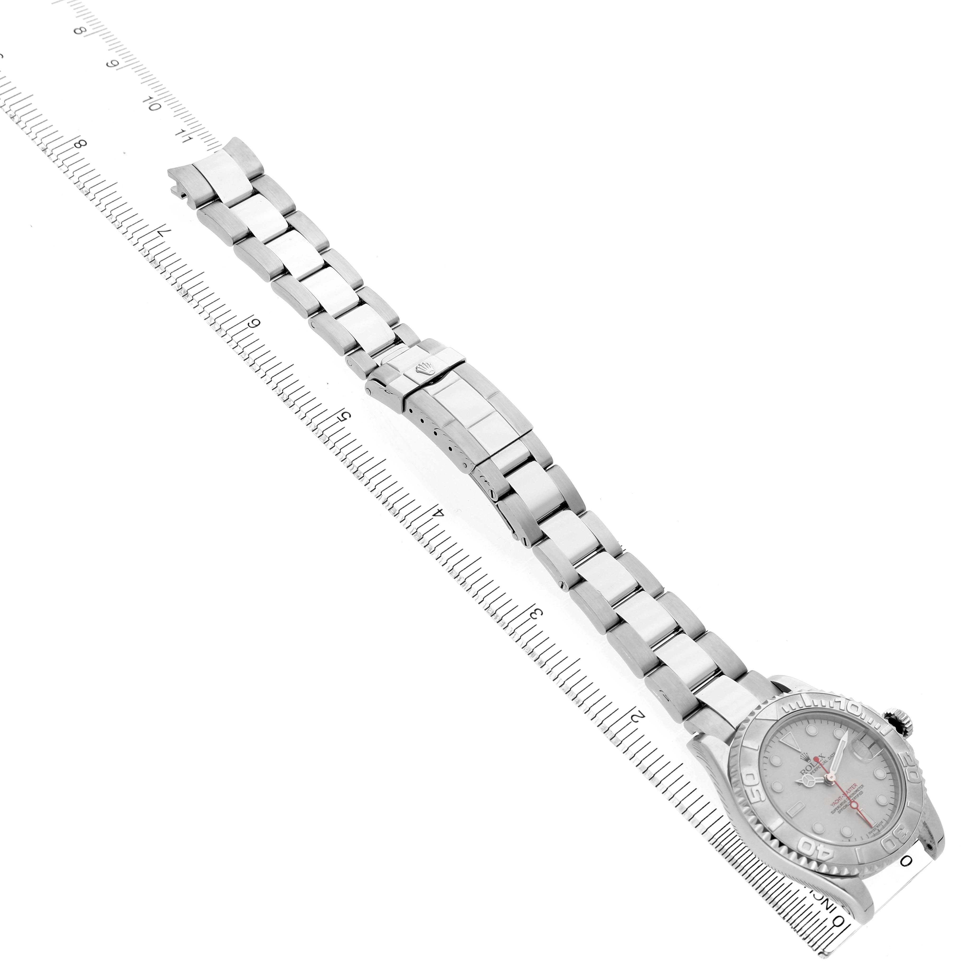 The image shows the Rolex Yacht-Master 168622 Men's Stainless Steel Silver Dial watch at an angled side view, highlighting the band, clasp, and dial, with a ruler beneath.