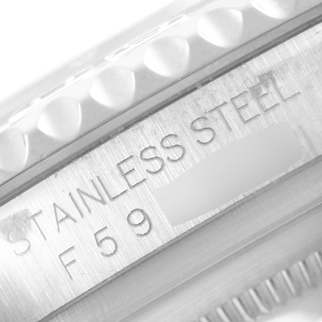 The image shows a close-up of the side of a Rolex Yacht-Master 16622 Men
s Stainless Steel Silver Dial 16622 Men
s Stainless Steel Silver Dial watch, focusing on the bezel and "STAINLESS STEEL" engraving.