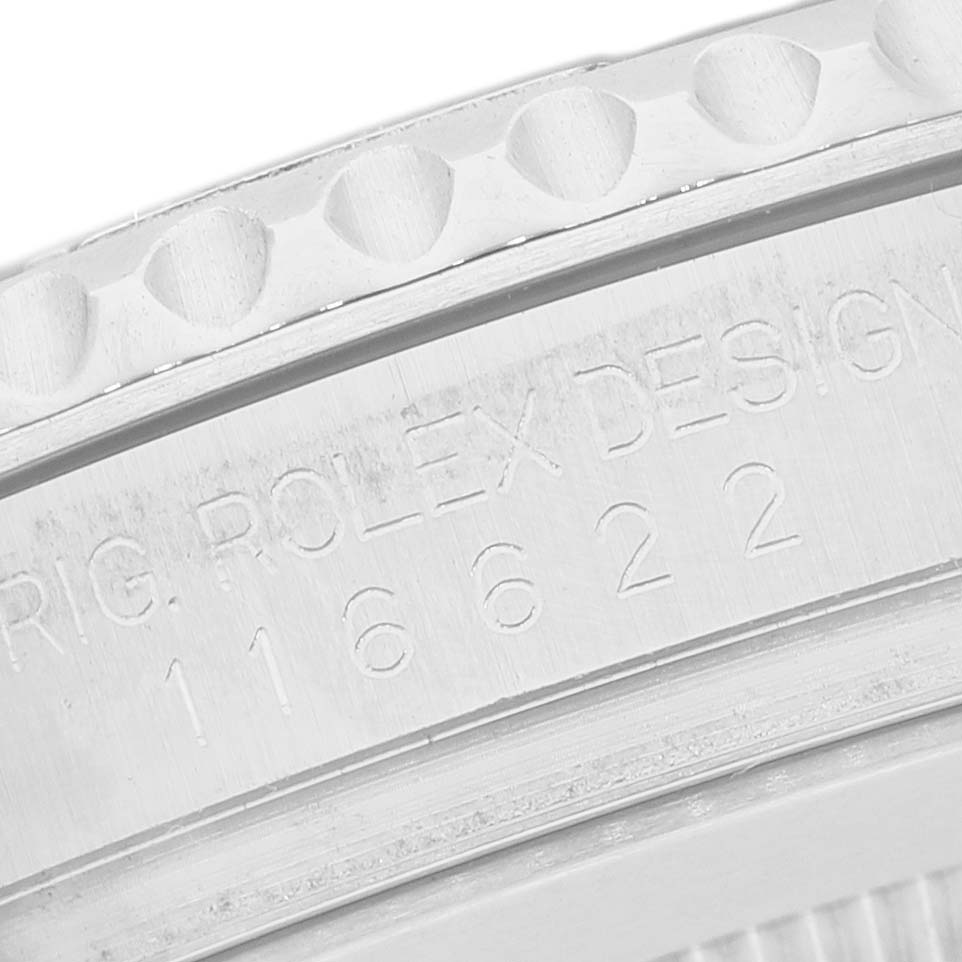 The image shows a close-up angle of the bezel and engraved text on a Rolex Yacht-Master 116622 Men's Stainless Steel Silver Dial watch.