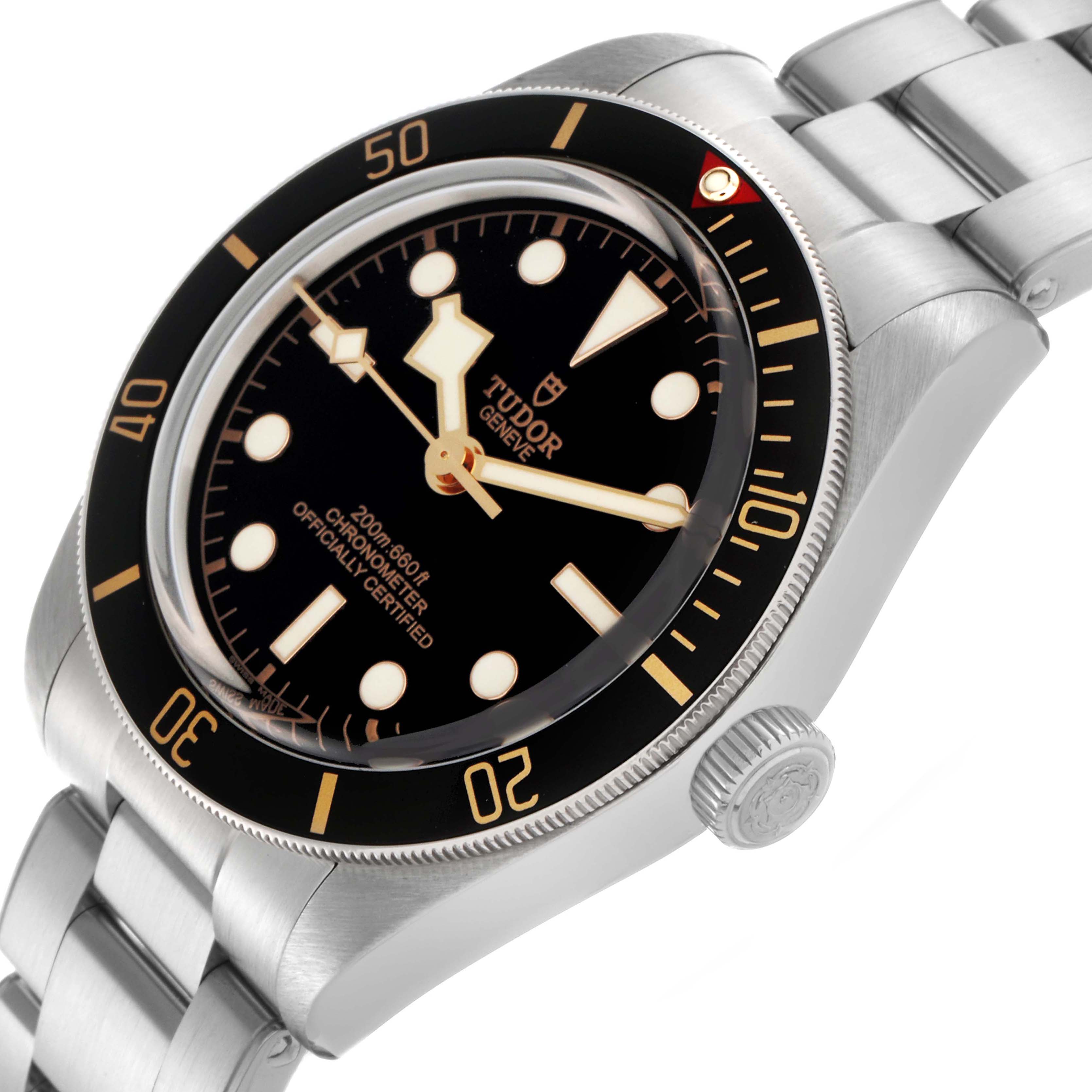The Tudor Heritage Black Bay M79030N-0001 Men
s Stainless Steel Black Dial M79030N-0001 Men
s Stainless Steel Black Dial watch is shown at an angled view featuring the dial, bezel, crown, and part of the bracelet.