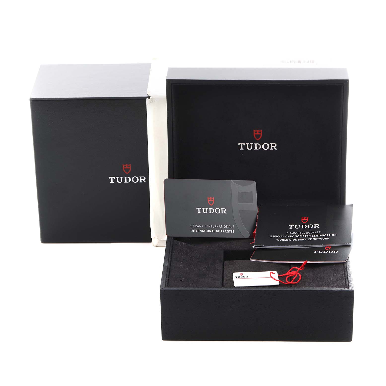The image shows the Tudor Heritage Black Bay M79030N-0001 Men
s Stainless Steel Black Dial M79030N-0001 Men
s Stainless Steel Black Dial packaging, warranty card, and manual from a frontal angle.