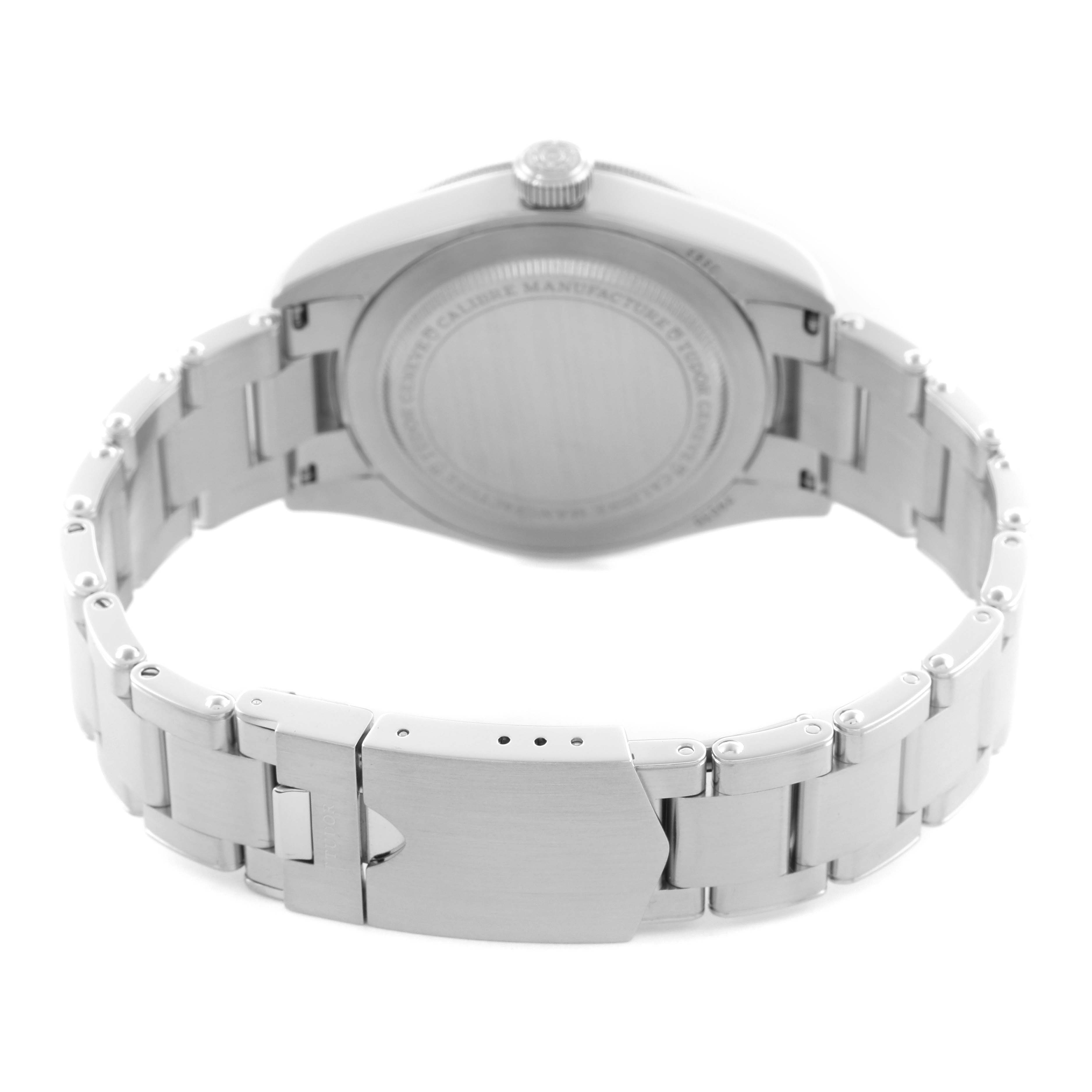 The image shows the back of the Tudor Heritage Black Bay M79030N-0001 Men
s Stainless Steel Black Dial M79030N-0001 Men
s Stainless Steel Black Dial watch, featuring the case back and bracelet clasp.