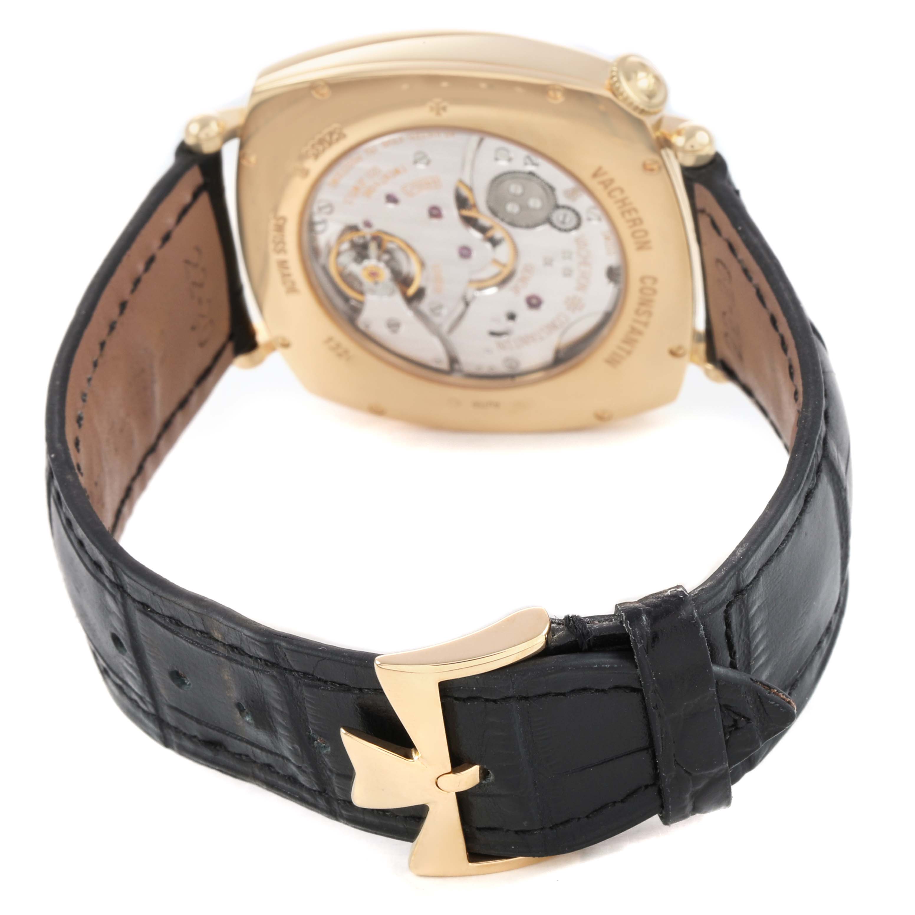 The image shows the back view of a Vacheron Constantin Historiques 82035/000R-9359 Men's Rose Gold Silver Dial watch, highlighting its movement and leather strap with a gold clasp.