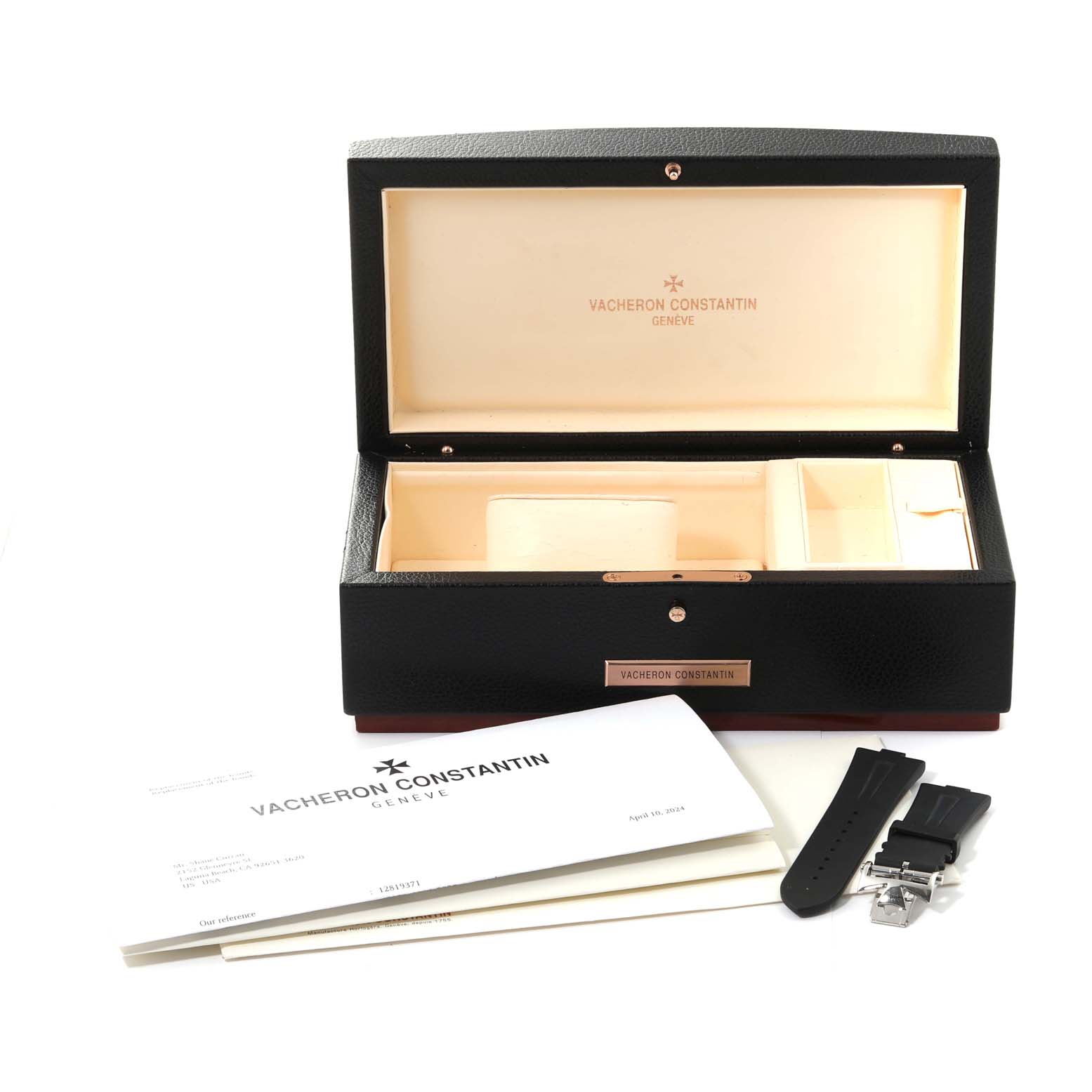 The image shows an open Vacheron Constantin Overseas 49150/B01A-9097 Men's Stainless Steel Black Dial 49150/B01A-9097 Men's Stainless Steel Black Dial watch box, documents, and a set of black watch straps with a clasp.