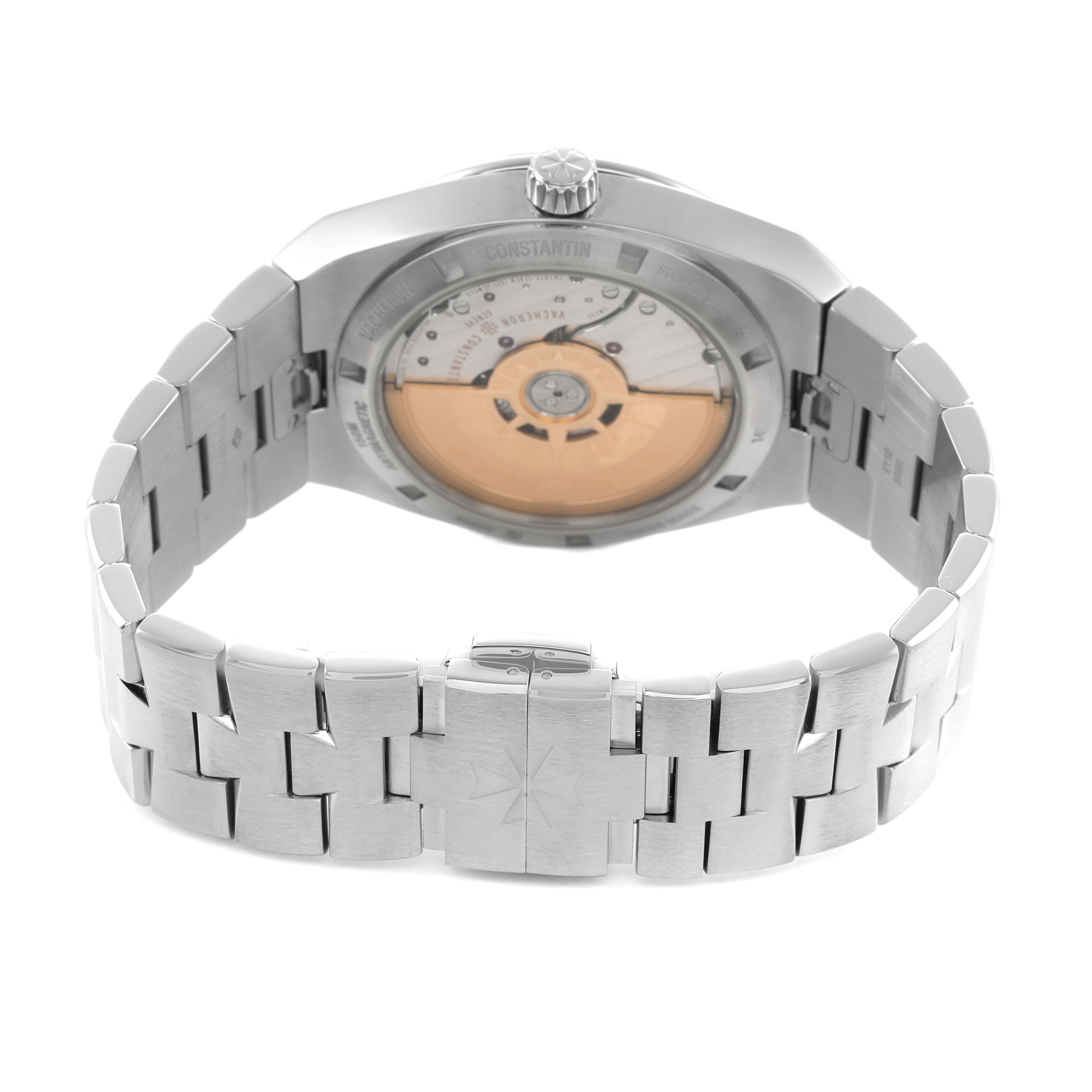The image shows the back view of a Vacheron Constantin Overseas 4500V Mens Stainless Steel Blue Dial model, highlighting the exhibition case back and metal bracelet clasp.