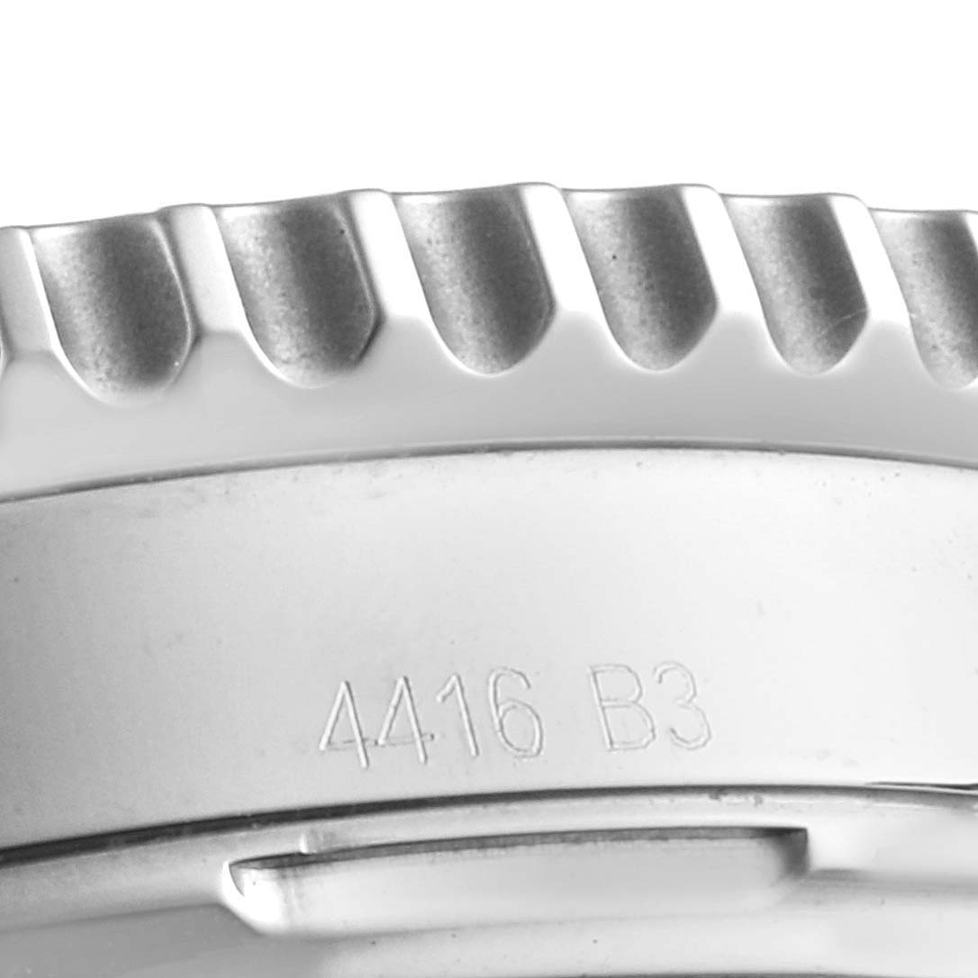 The image shows a close-up angle of the bezel edge and part of the back casing of a Breitling Navitimer AB0120 Men
s Stainless Steel Black Dial AB0120 Men
s Stainless Steel Black Dial watch.