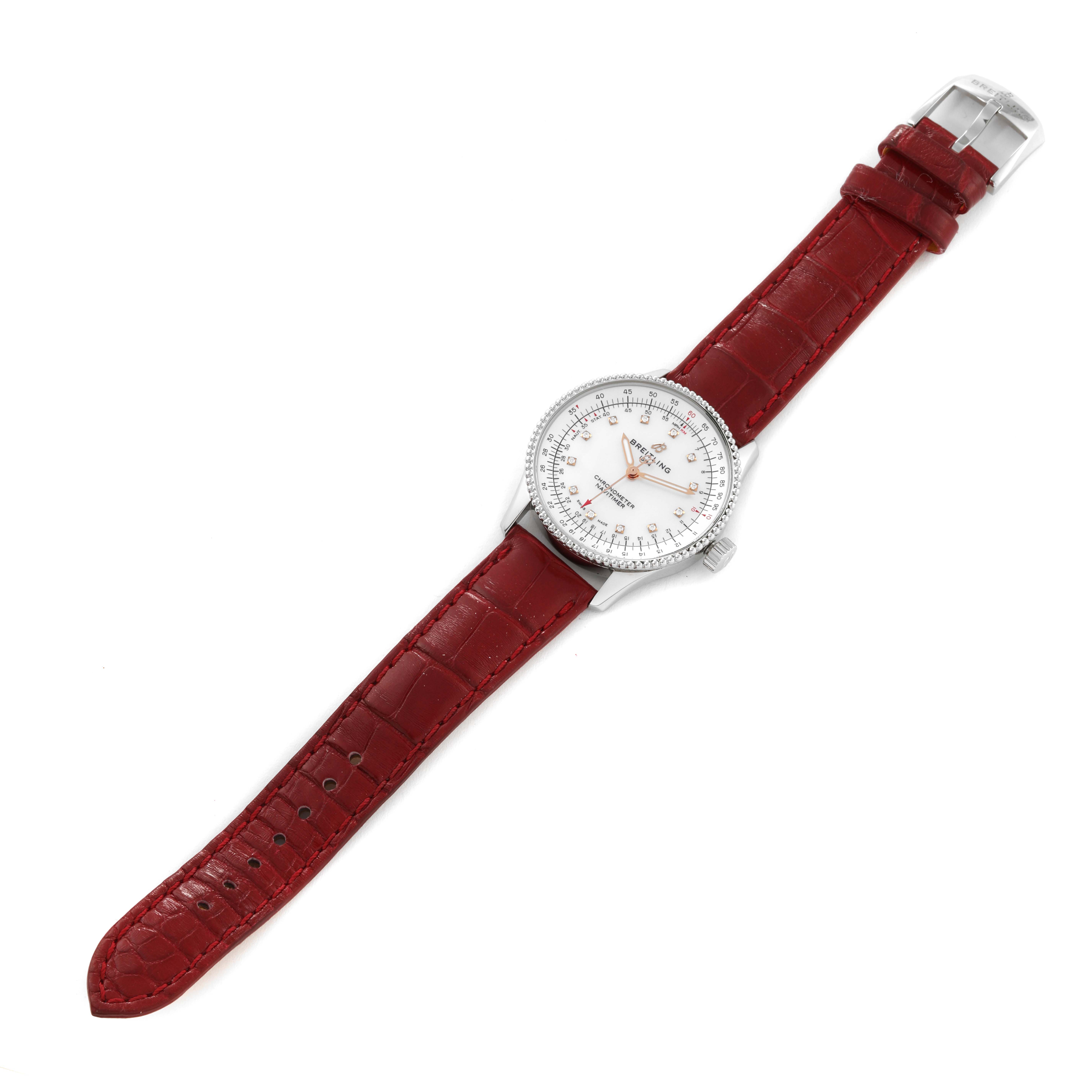 The Breitling A17395 Women's Stainless Steel Mother of Pearl Dial A17395 Women's Stainless Steel Mother of Pearl Dial Navitimer Automatic 35 A17395 model is shown from a top-down angle, highlighting its mother of pearl dial and red leather strap.