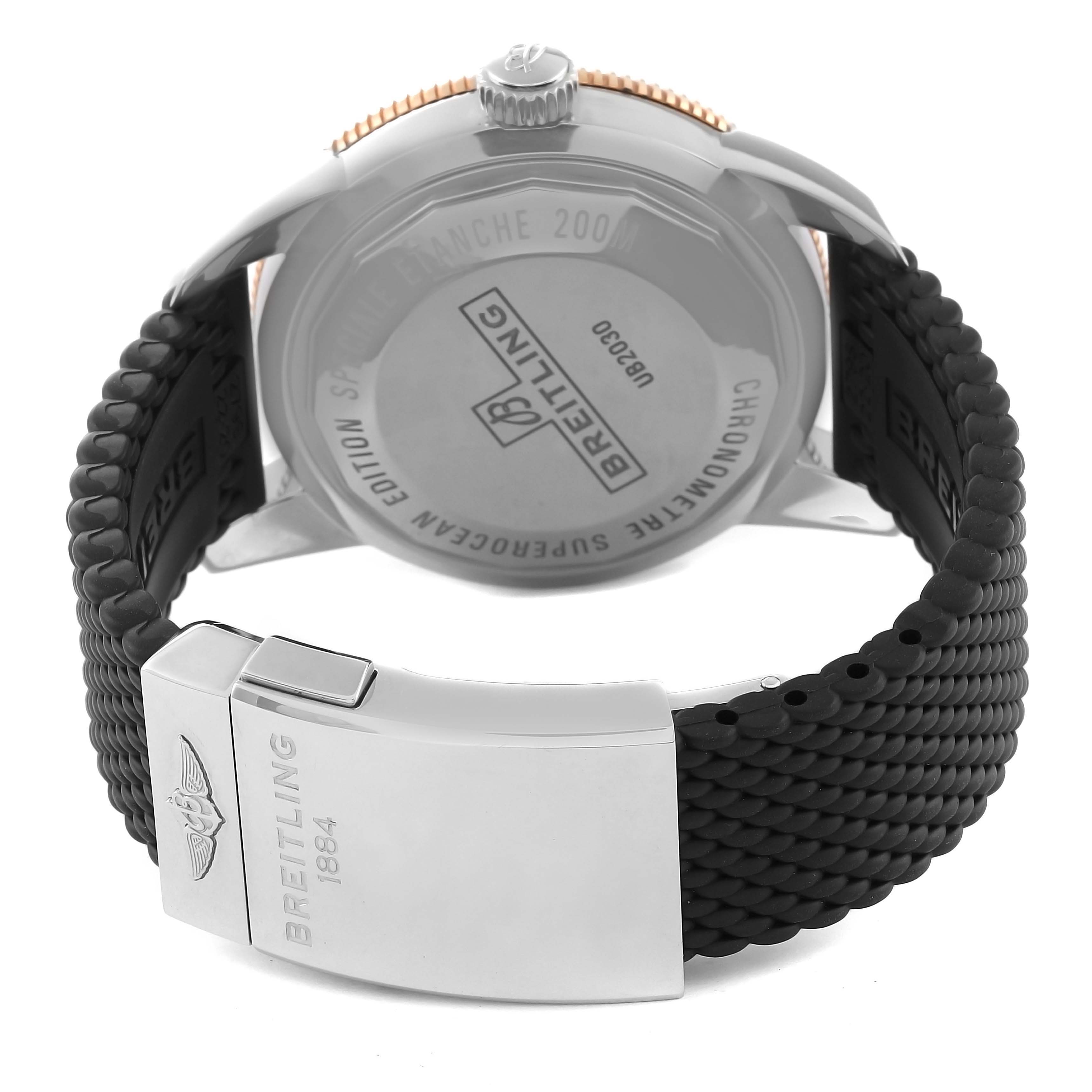 The image shows the back view of the Breitling Superocean UB2030121B1A1 Men's Steel and Gold (two tone) Black Dial UB2030121B1A1 Men's Steel and Gold (two tone) Black Dial watch, highlighting the case back and the rubber strap with clasp.