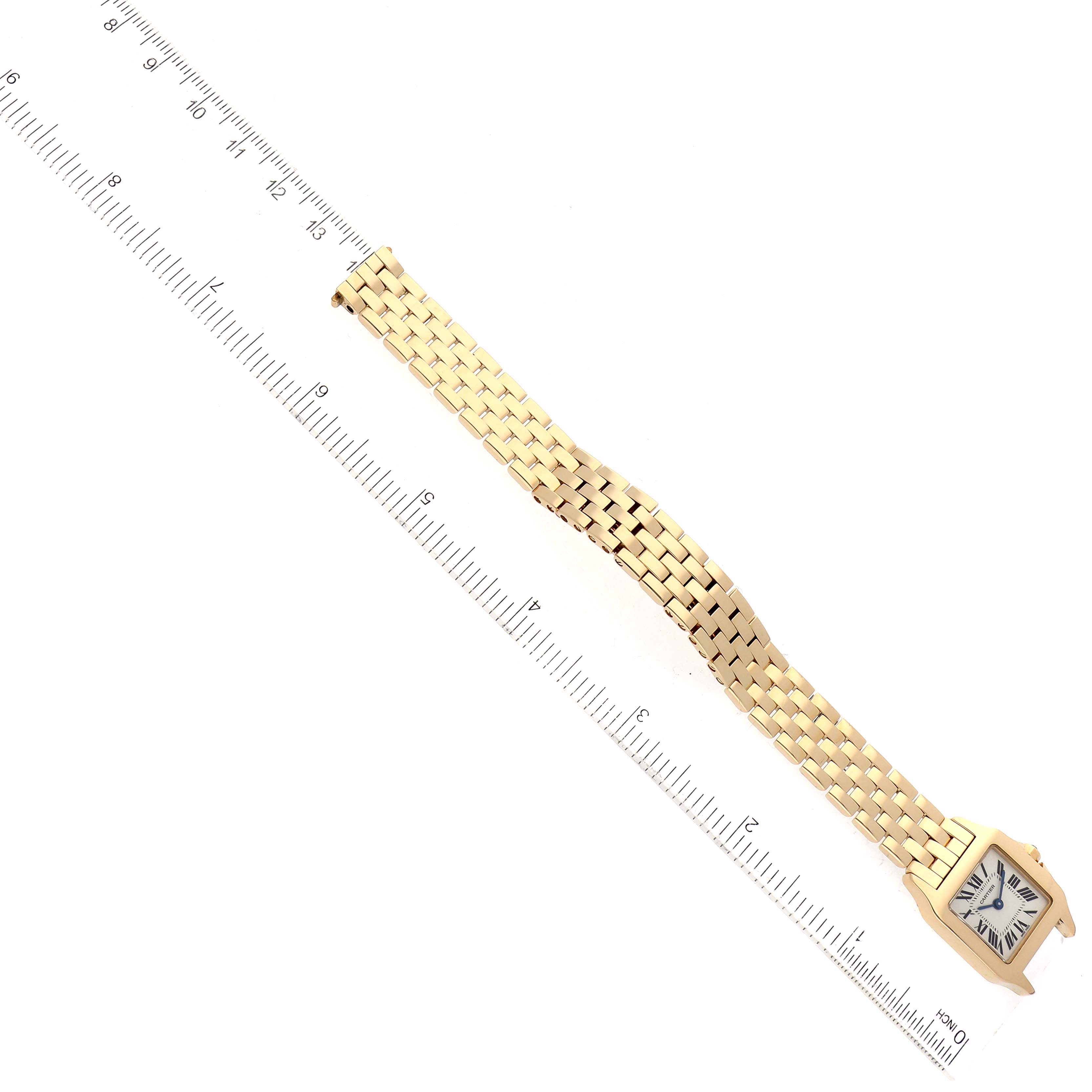 The Cartier Santos Demoiselle W25063X9 Women's Yellow Gold Silver Dial W25063X9 Women's Yellow Gold Silver Dial watch is shown from a top-down angle, highlighting its square face and the full length of its gold bracelet.