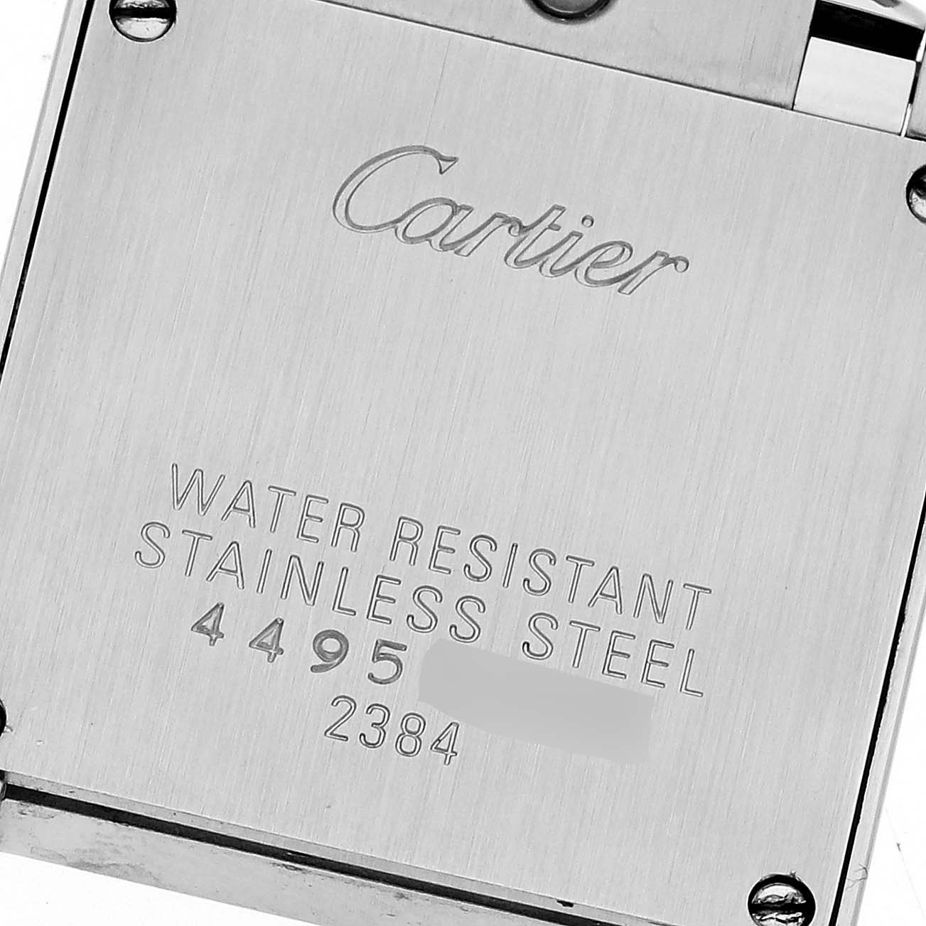 The image shows the case back of a Cartier Tank Francaise W51026Q3 Women's Stainless Steel Black Dial W51026Q3 Women's Stainless Steel Black Dial watch, highlighting the engraved details and water resistance information.