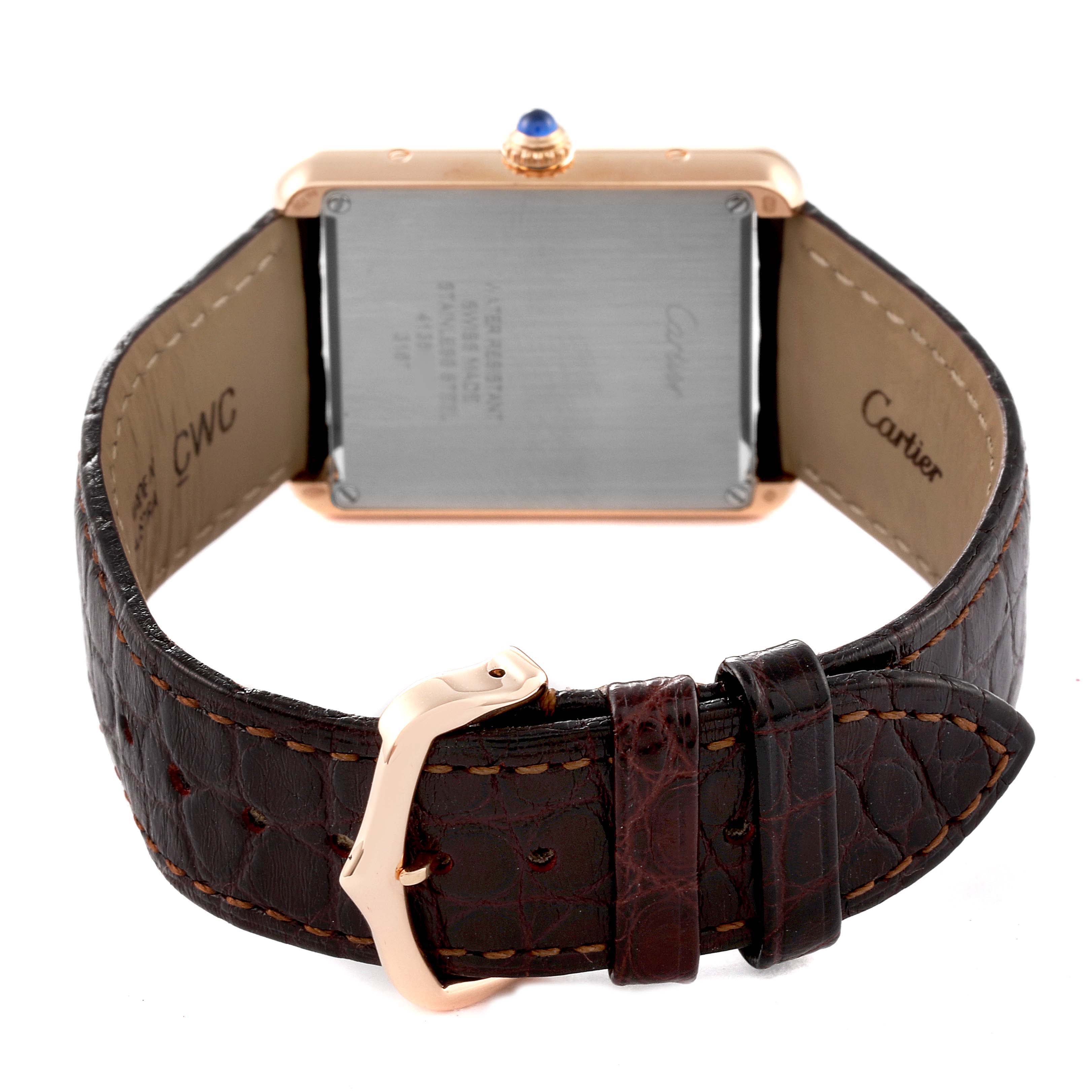The image shows the back view of a Cartier Tank Solo W5200025 Men
s Rose Gold Silver Dial W5200025 Men
s Rose Gold Silver Dial watch, highlighting the caseback and brown leather strap with a rose gold buckle.